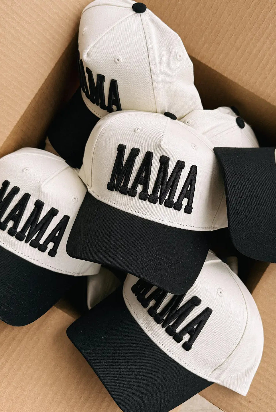 Mama Cream and Black Puff Trucker Hat by ETTA & EAST, featuring a cream crown and black puffed front panel.