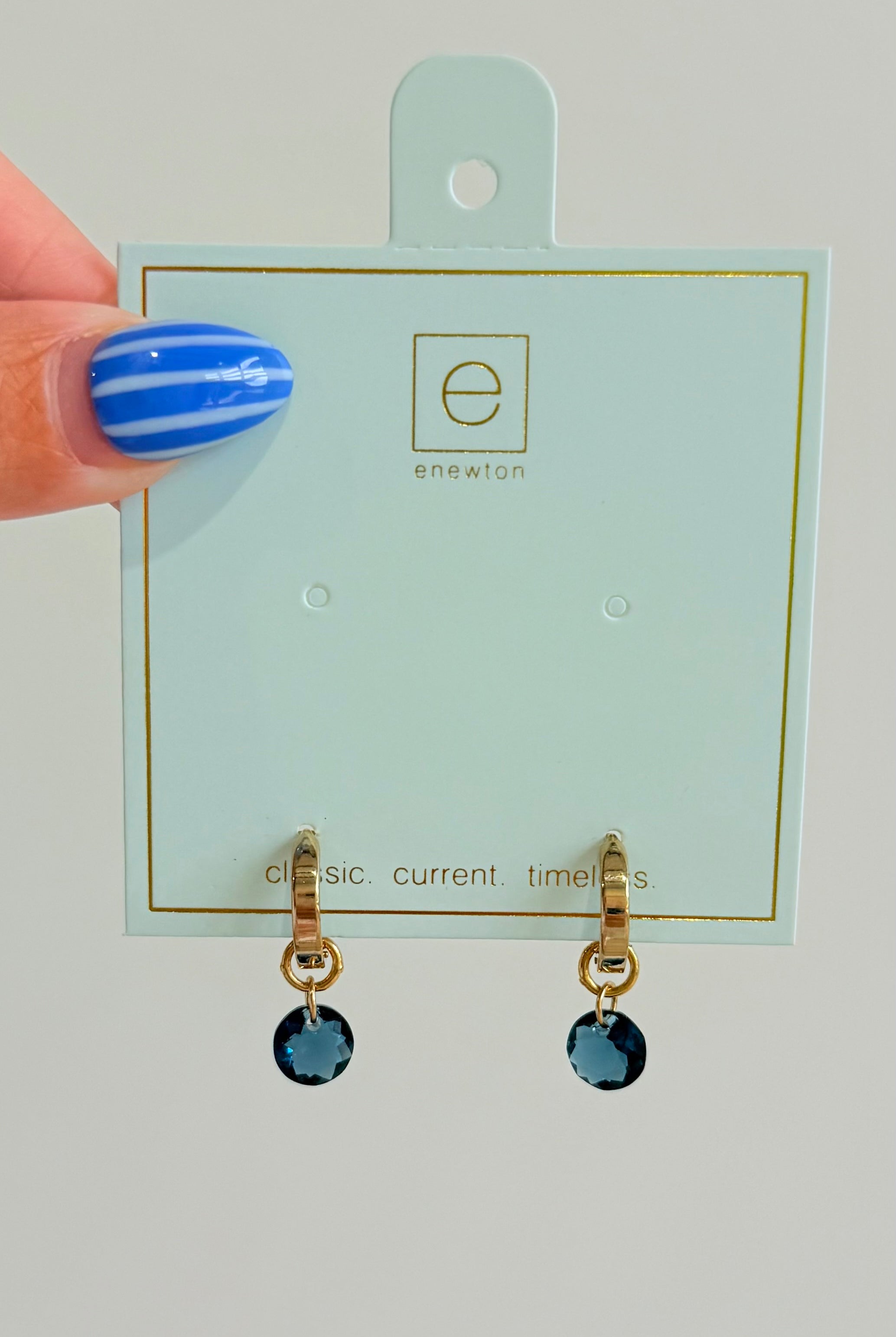 Enewton .5mm Classic Birthstone Huggie earrings featuring small, sparkling gemstone accents and a silver-tone finish.