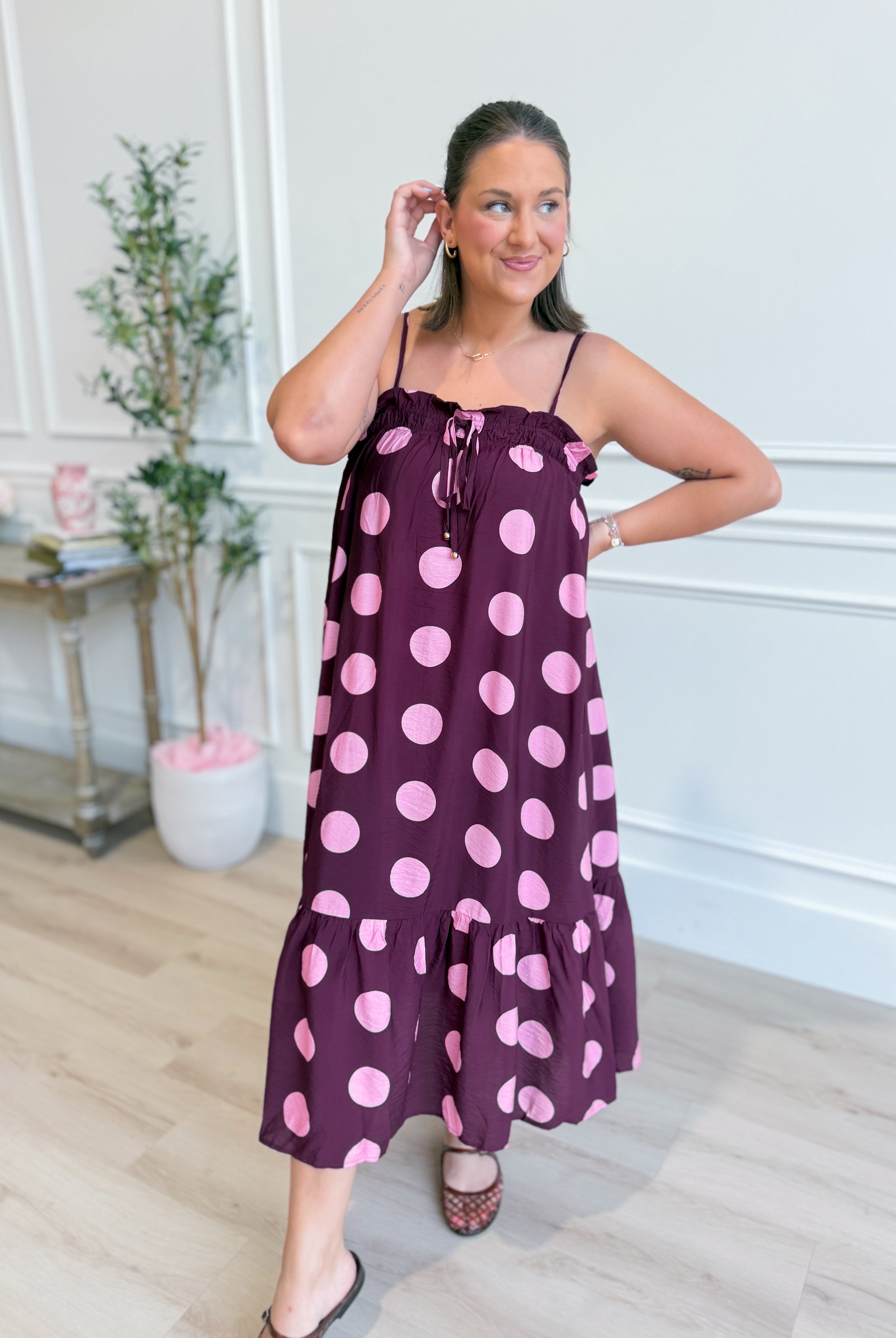 ENTRO Ashton polka dot midi dress featuring a stylish pattern, fitted waist, and elegant length, perfect for dressy occasions.
