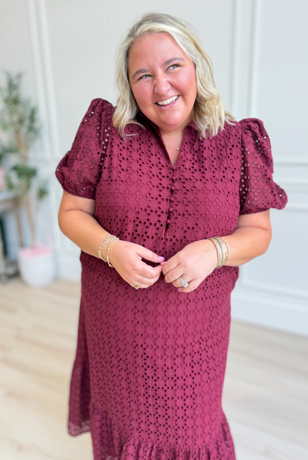 ENTRO Katie eyelet puff sleeve midi dress with a fitted waist and floral eyelet fabric, perfect for dressy occasions.