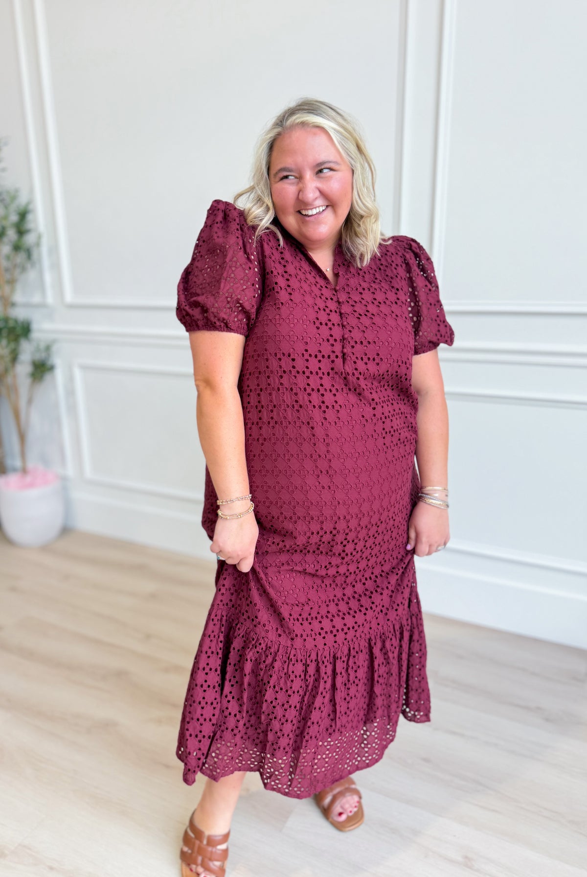 ENTRO Katie eyelet puff sleeve midi dress showing a stylish, feminine design with puff sleeves and eyelet detailing.