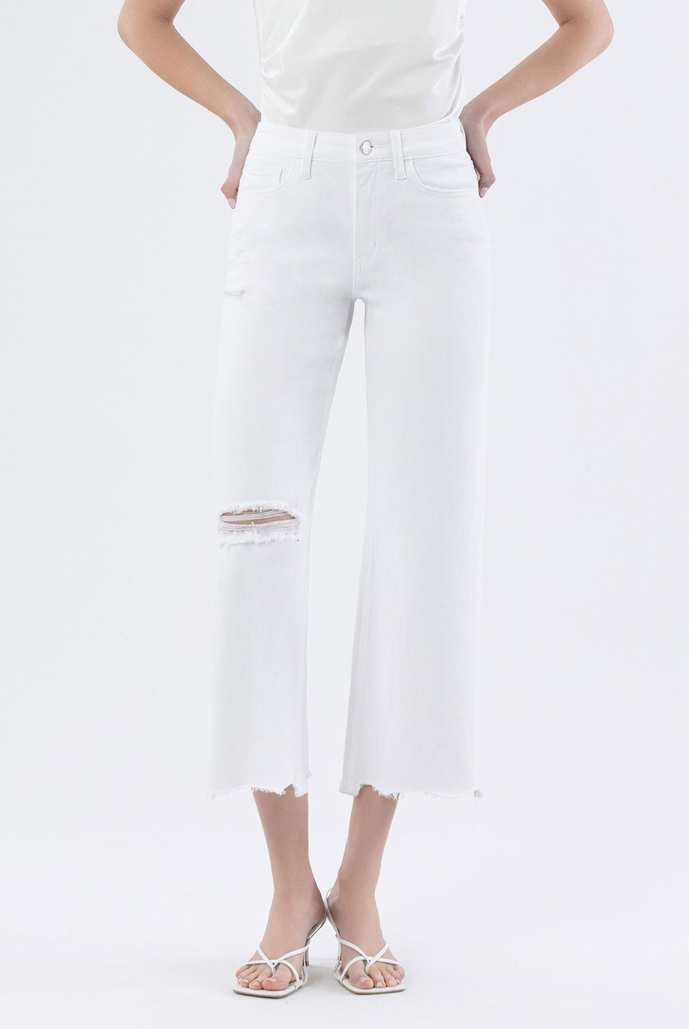 Vervet Optic White High Rise Wide Leg Jeans from the 146 Core Jeans collection, displayed on a hanger with a plain background.