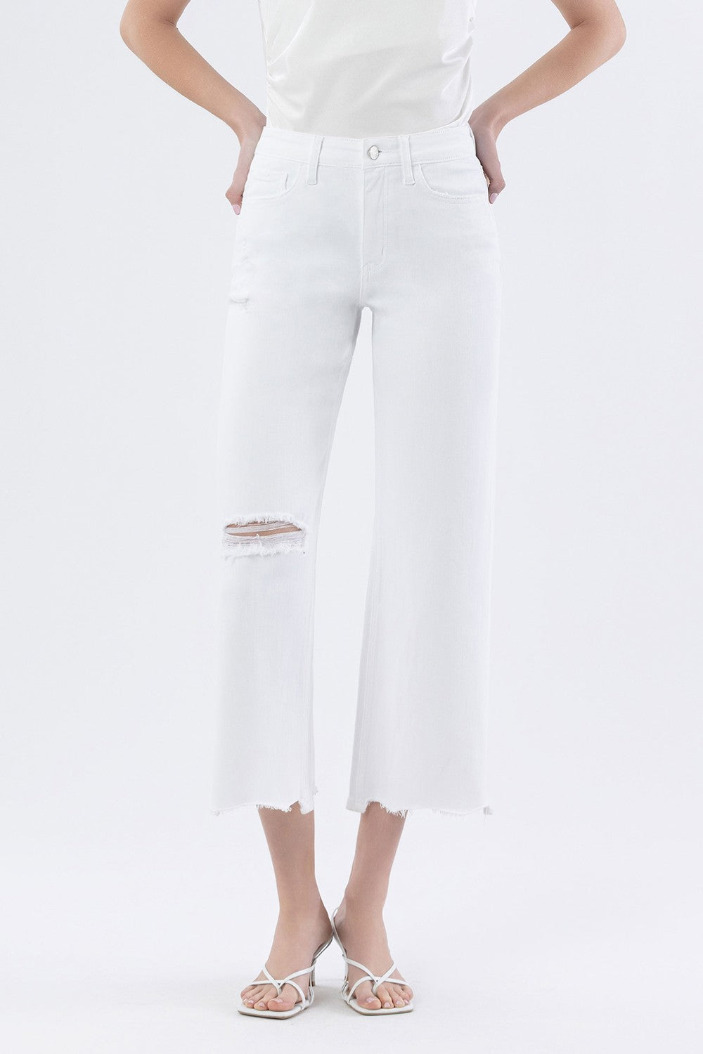 Vervet Optic White High Rise Wide Leg Jeans from the 146 Core Jeans collection, displayed on a hanger with a plain background.
