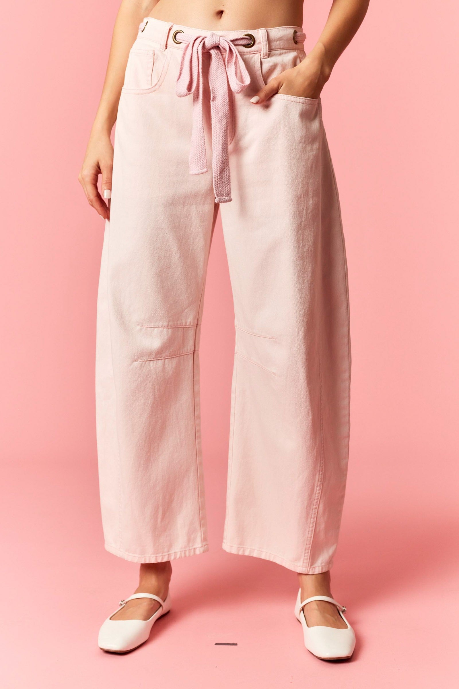 Light pink Candice barrel jeans by PEACH LOVE featuring mineral wash and eyelet details from the 147 Novelty Jeans collection.