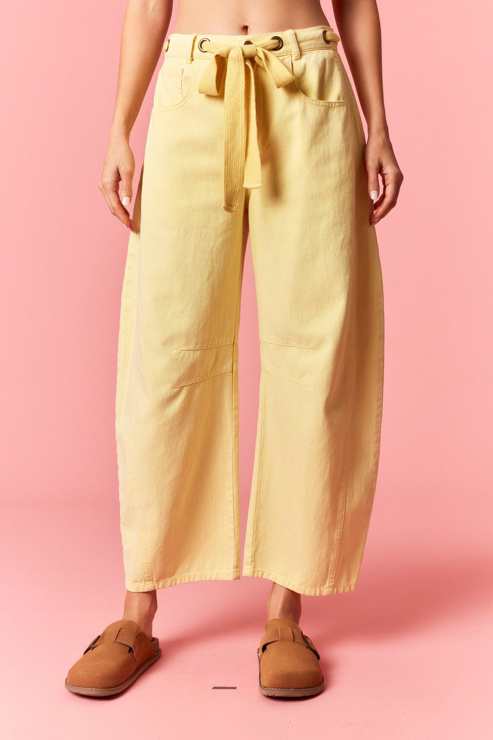 Light yellow mineral washed PEACH LOVE Candice 147 novelty barrel jeans with eyelet details and relaxed fit.