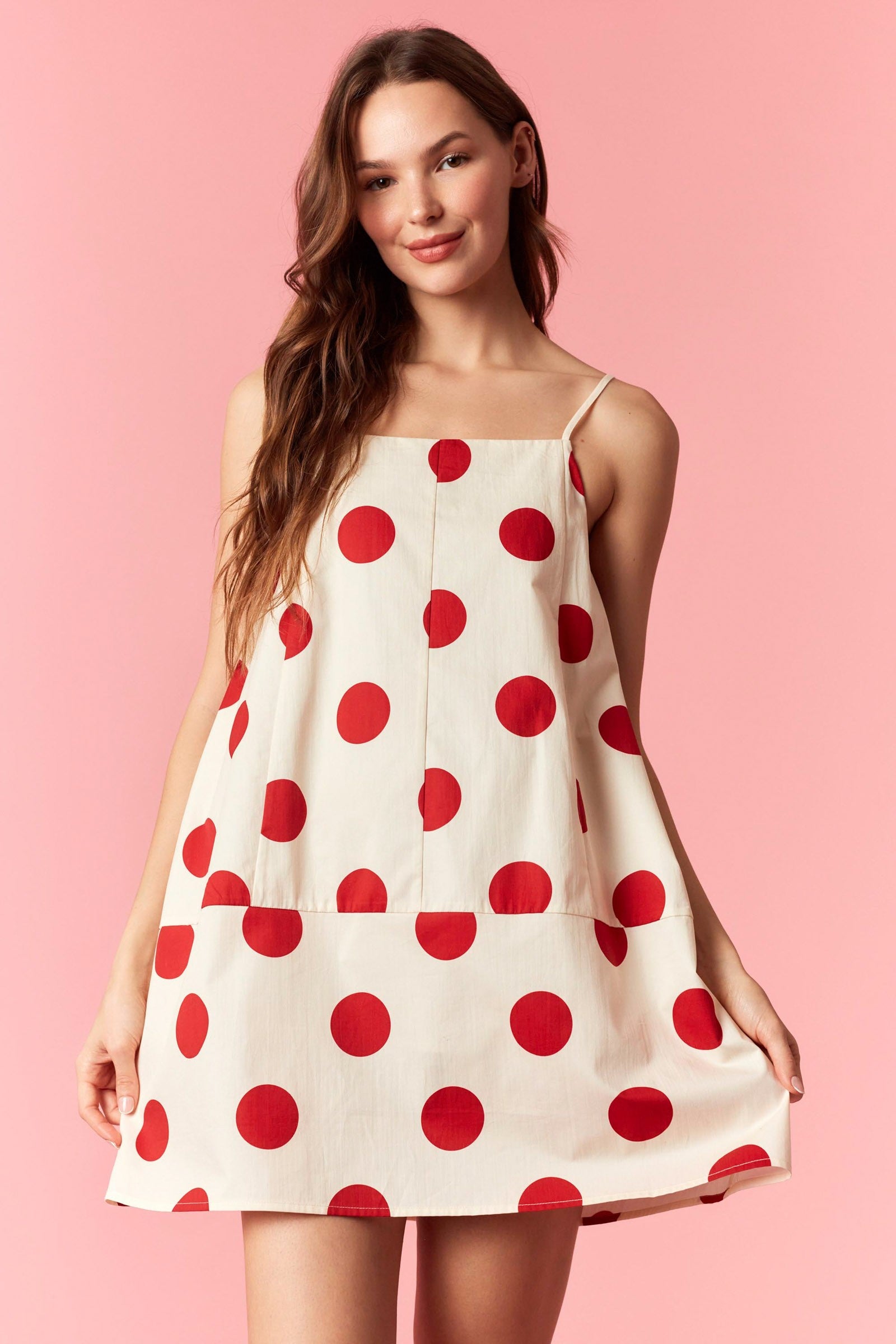 PEACH LOVE Jenna polka dot summer dress with a sleeveless design and flowy skirt, perfect for warm weather.