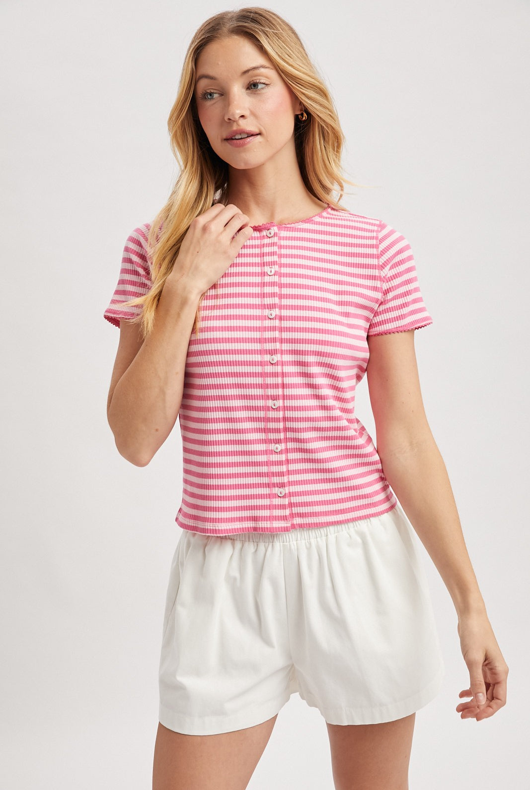 Pink striped ribbed knit top from WISHLIST, casual Molly 105 top featuring a fitted design and textured fabric.