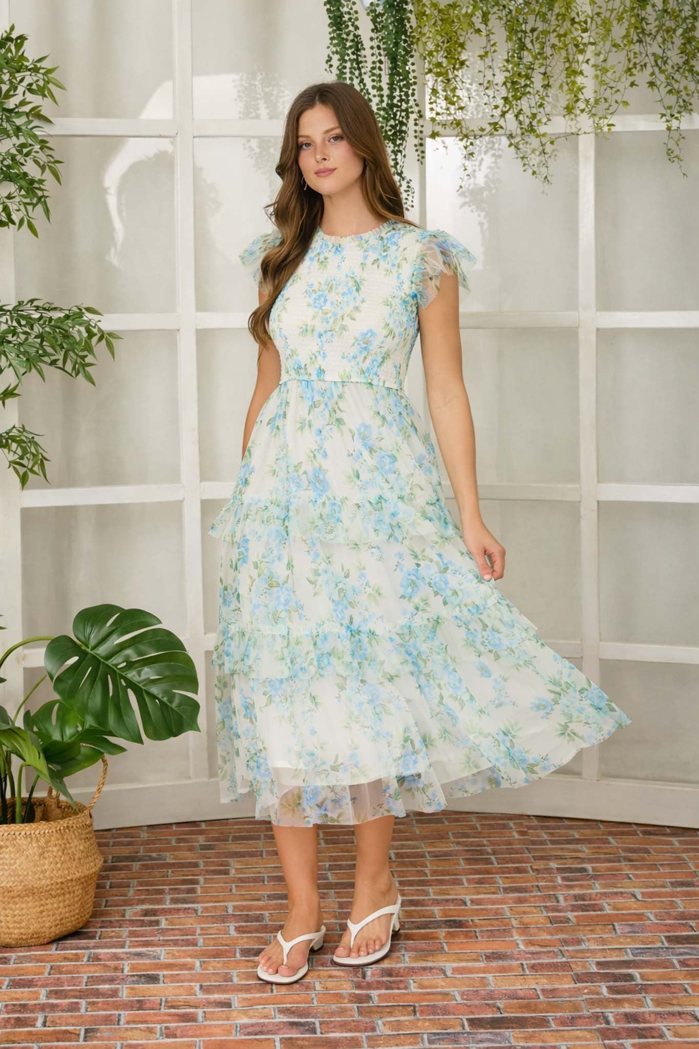 Blue floral tulle smocked dress from BLU PEPPER, featuring a flowy design with delicate floral patterns and elegant dressy style.