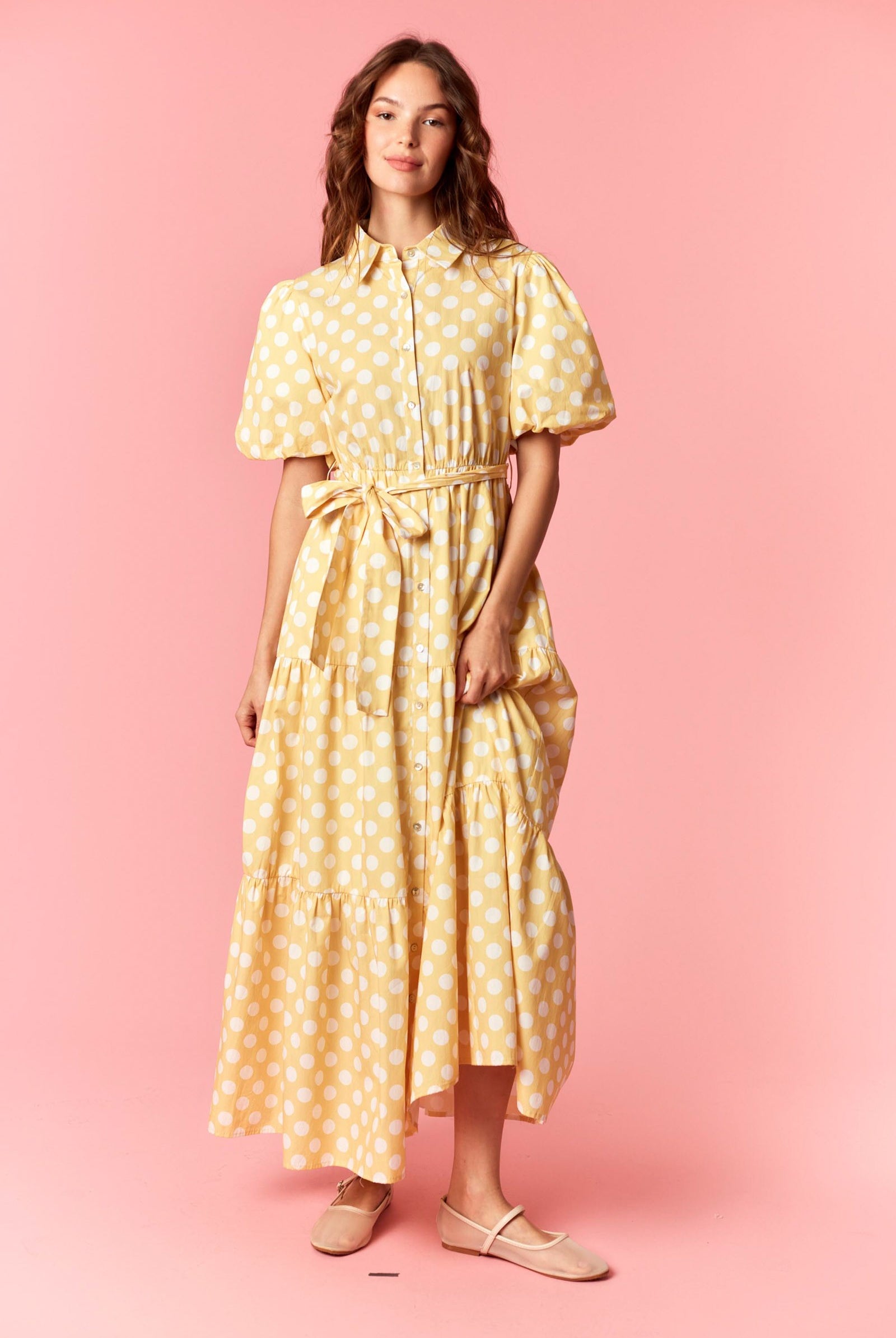 PEACH LOVE Everleigh Polka Dot Tiered Dress, a stylish 125 dressy dress with a tiered design and polka dot pattern, worn by a model.