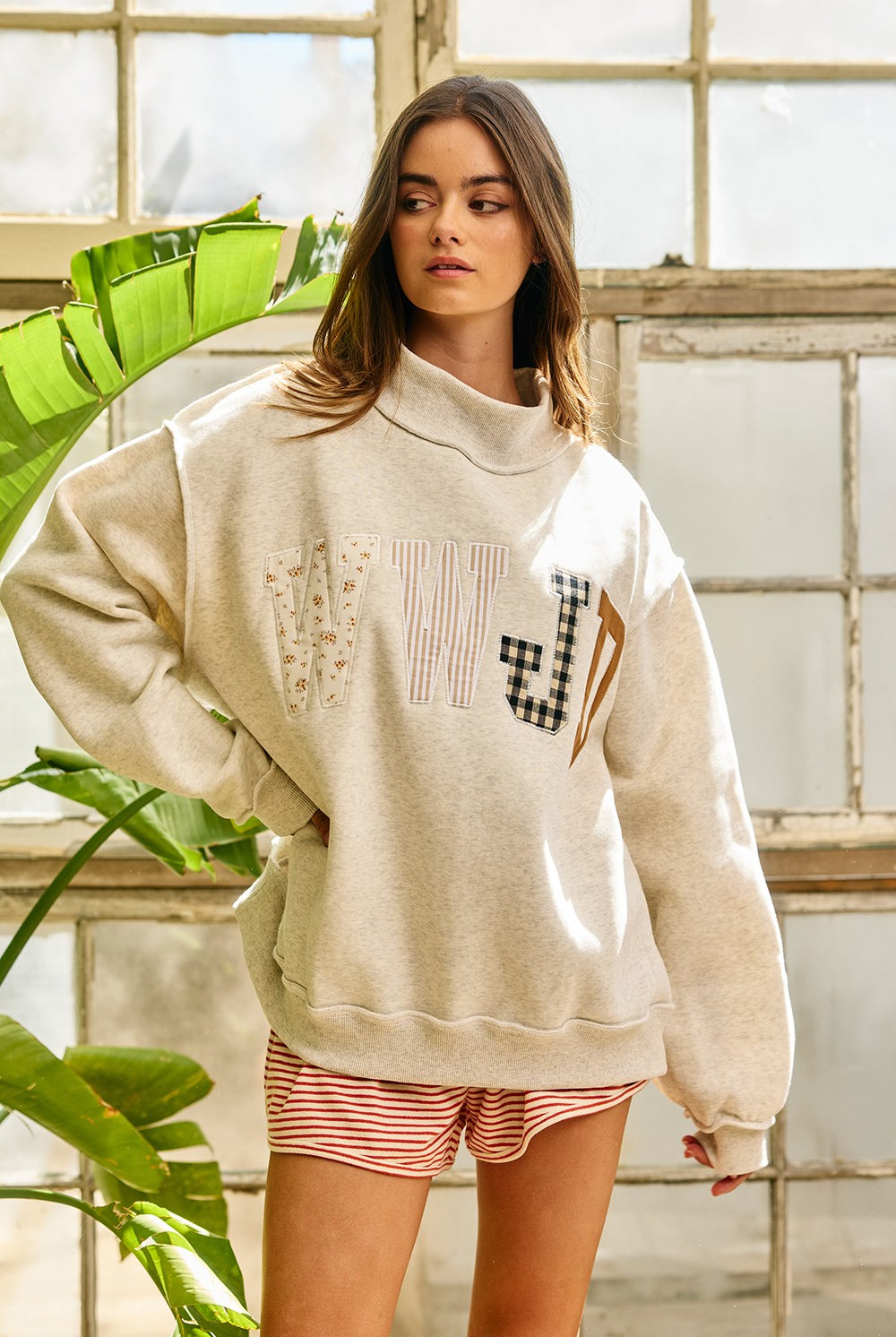 Black BUCKET LIST WWJD mock embroidered sweatshirt with graphic design, featuring embroidered "What Would Jesus Do?" text on front.