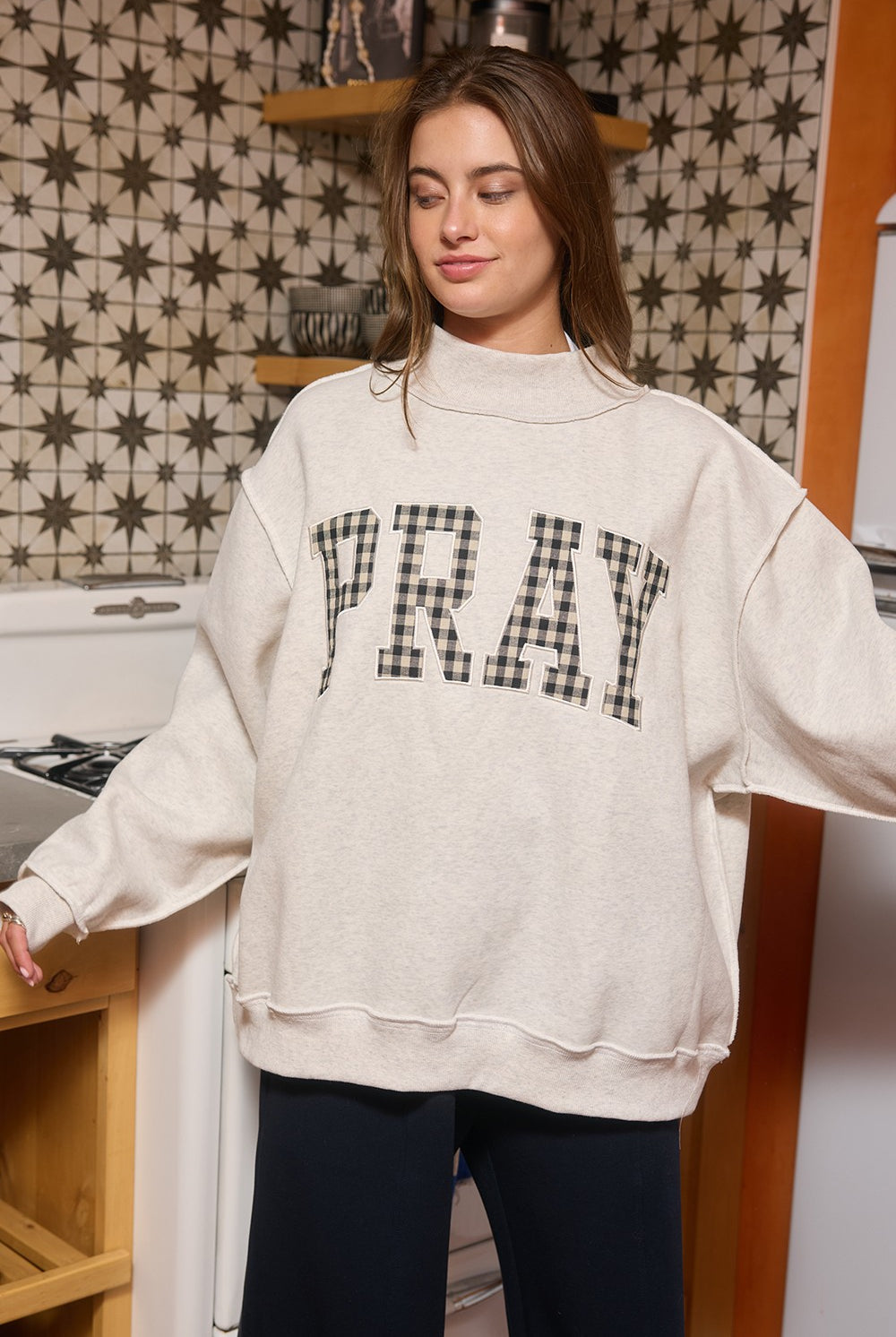 Pray Gingham Mock Neck Sweatshirt from BUCKET LIST, featuring a graphic design and gingham pattern, long sleeves, and a cozy fit.