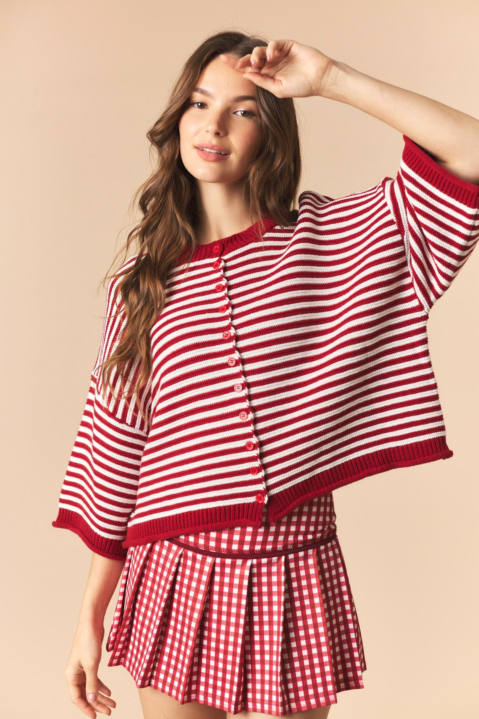 Red striped Izzie oversized sweater top with half sleeves from PEACH LOVE, perfect for fall casual wear.
