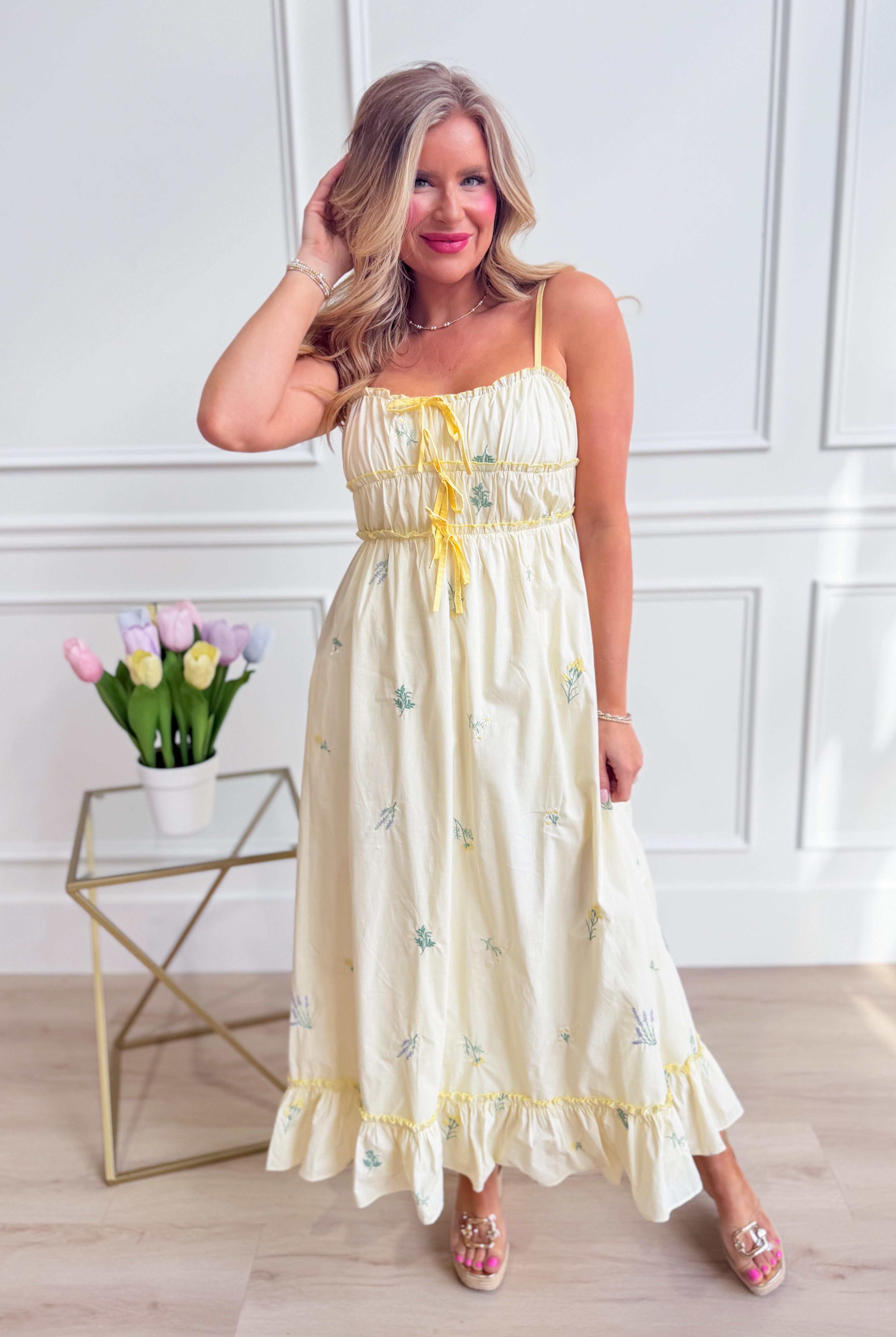WISHLIST Avery triple bow floral midi dress with a fitted bodice and flowy skirt, featuring colorful floral patterns and elegant design.
