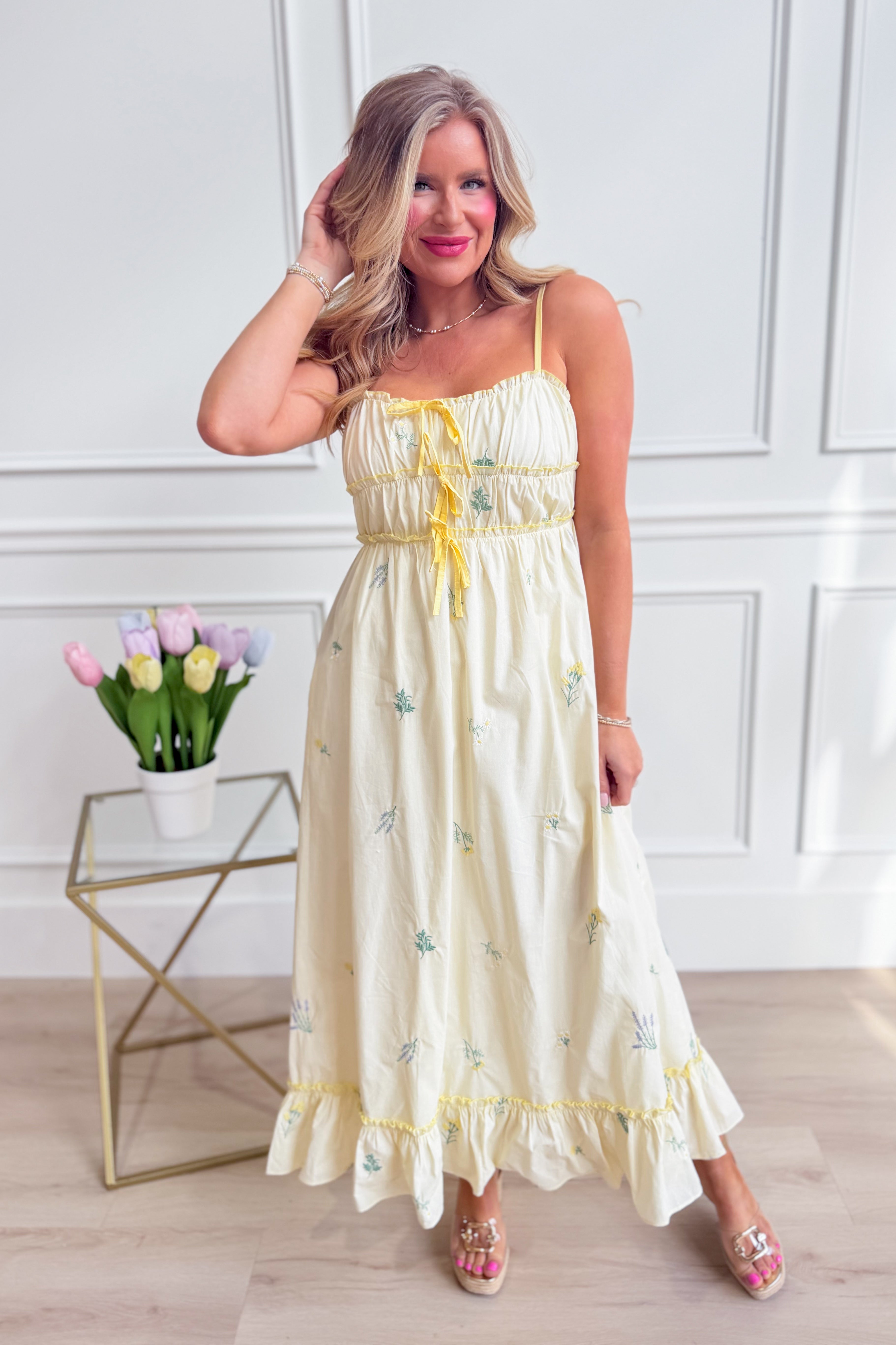WISHLIST Avery triple bow floral midi dress with a fitted bodice and flowy skirt, featuring colorful floral patterns and elegant design.