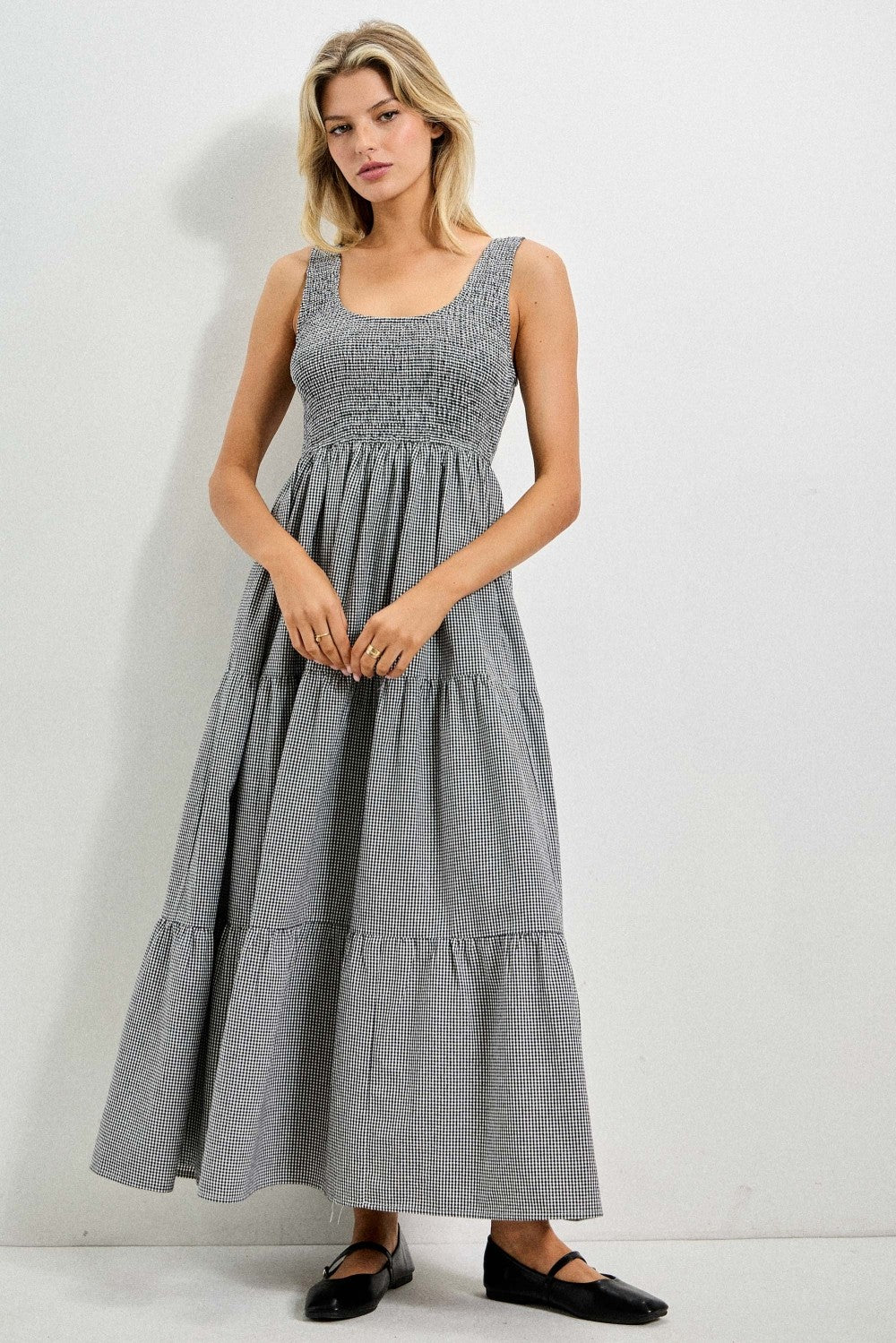 Baevly Painter Gingham Midi Dress featuring a classic gingham pattern, sleeveless design, and a flattering midi length.