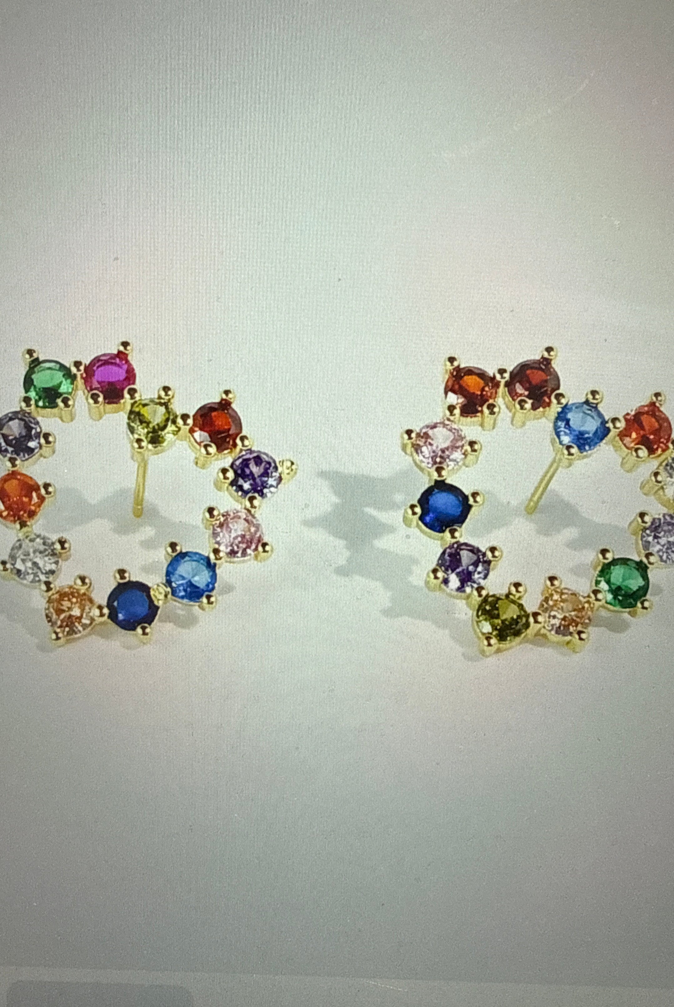 Sparkle multi-heart stud earrings by Treasure Jewels featuring shimmering jewel accents in a stylish jewelry setting.