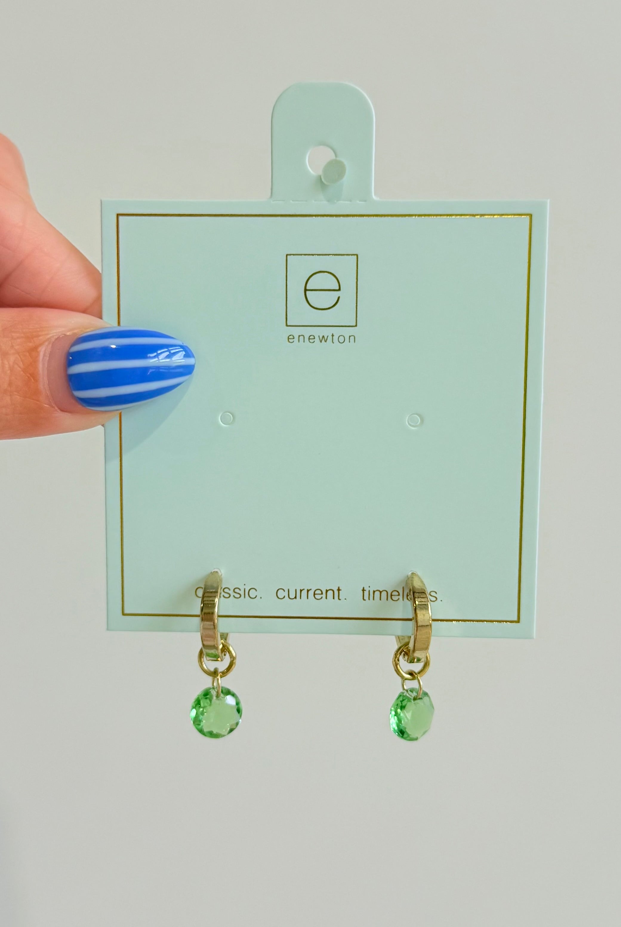 Enewton .5mm Classic Birthstone Huggie earrings in silver with small colorful birthstone accents, designed for pierced ears.