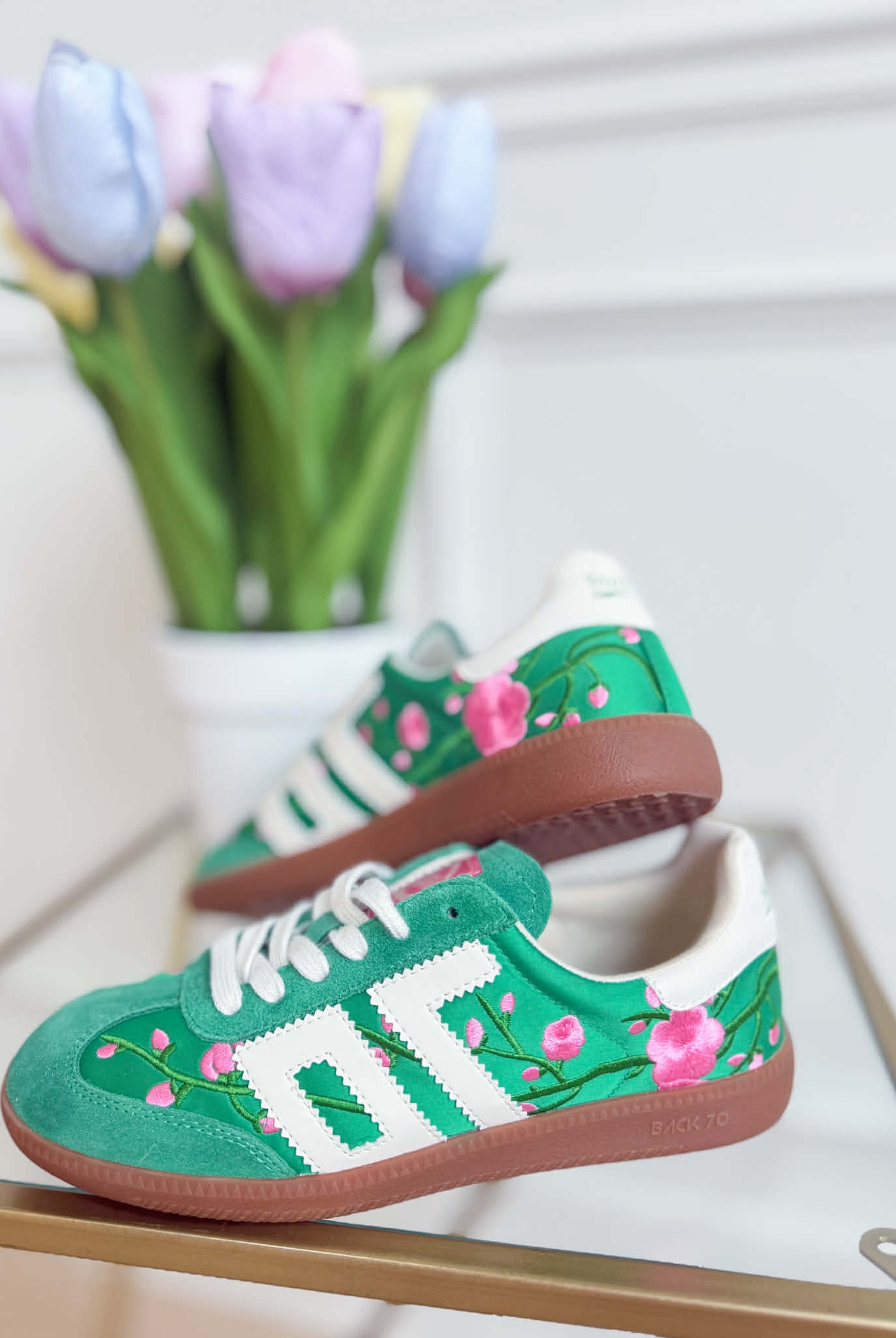 Green floral Ghost sneakers from BACK 70's 205 Sneakers collection featuring a sleek design and vibrant floral pattern.
