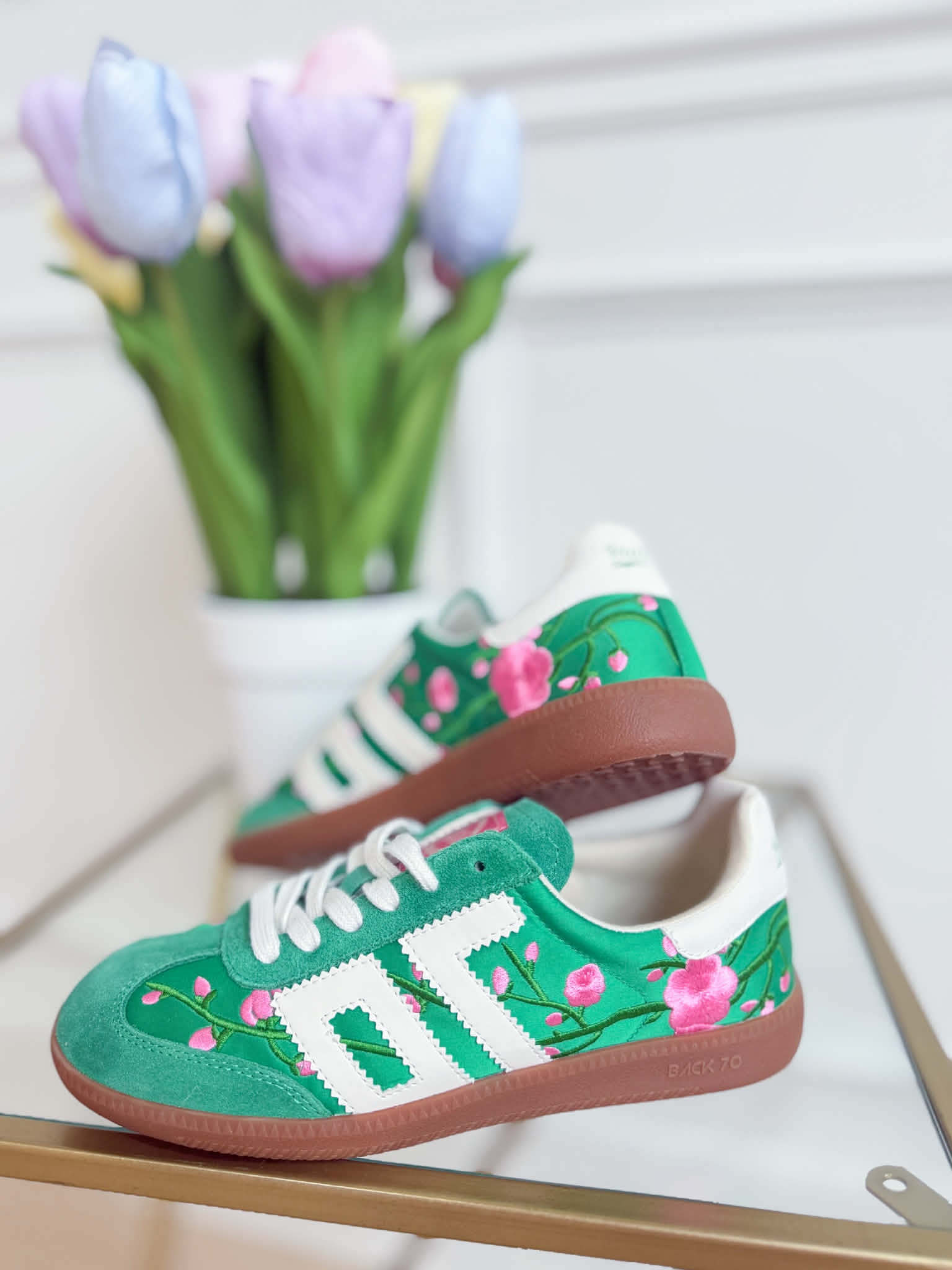 Green floral Ghost sneakers from BACK 70's 205 Sneakers collection featuring a sleek design and vibrant floral pattern.