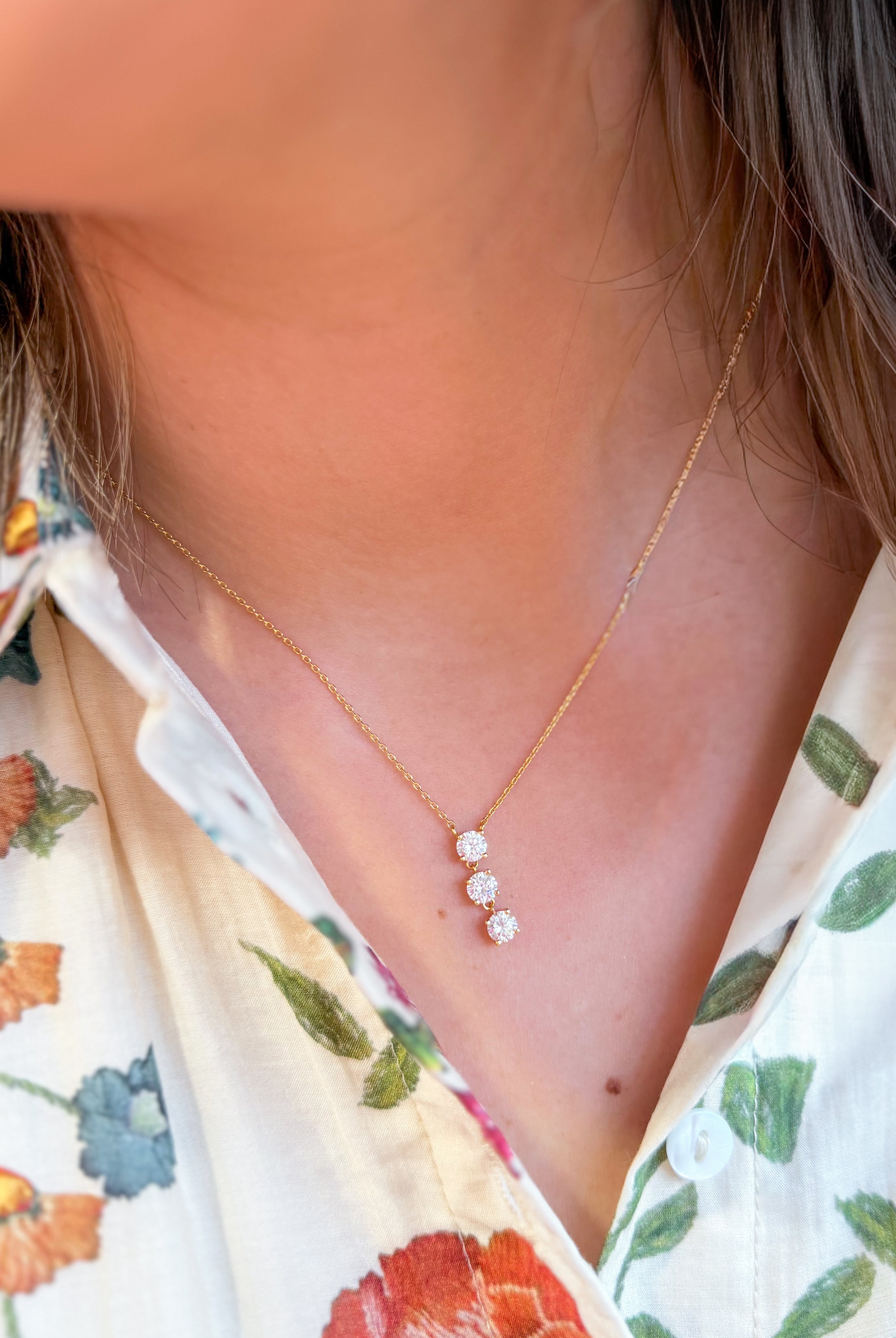 Gold triple CZ drop necklace from WHATS HOT, featuring layered design with sparkling cubic zirconia stones, for elegant jewelry style.