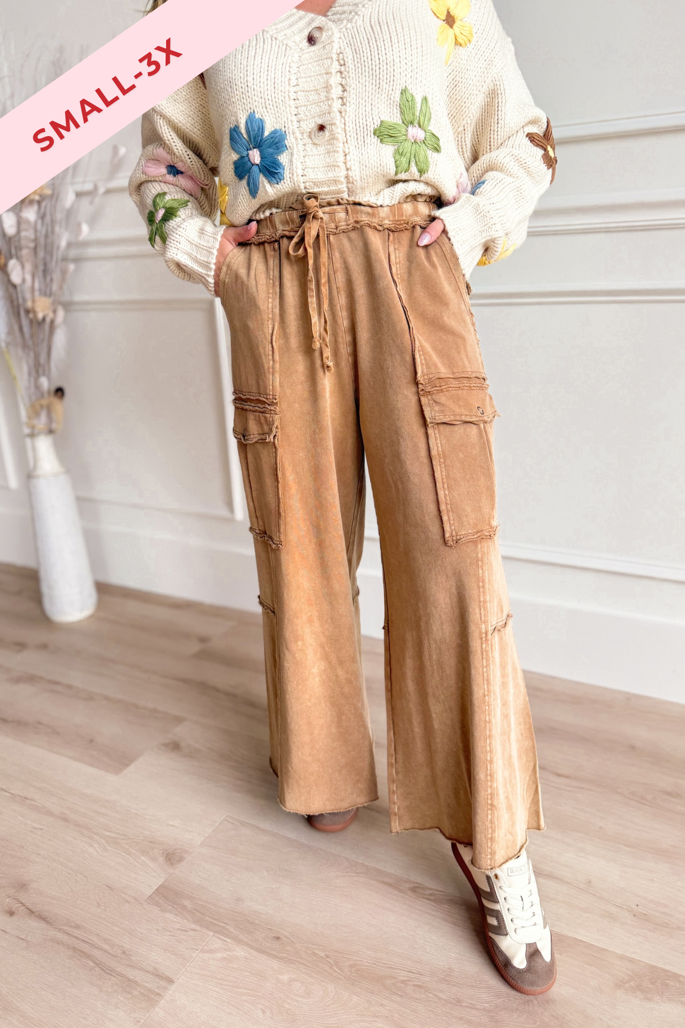 EASEL Mateo Mineral Washed Wide Leg Cargo Pants in neutral color, relaxed fit, with large front pockets and waistband.