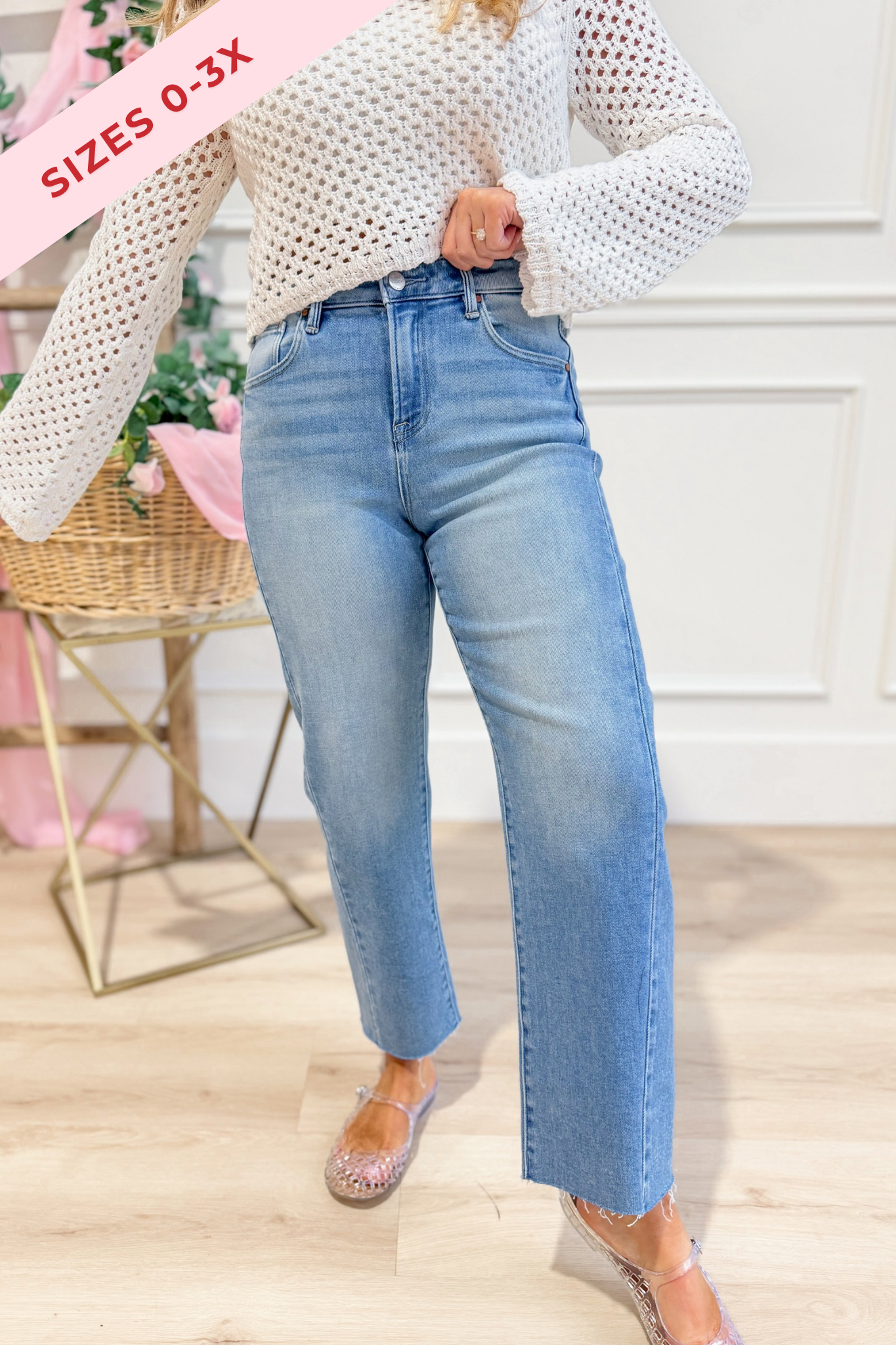 RISEN Boone high rise slouchy cropped barrel jeans in light wash denim, displayed on a hanger with rolled cuffs and relaxed fit.