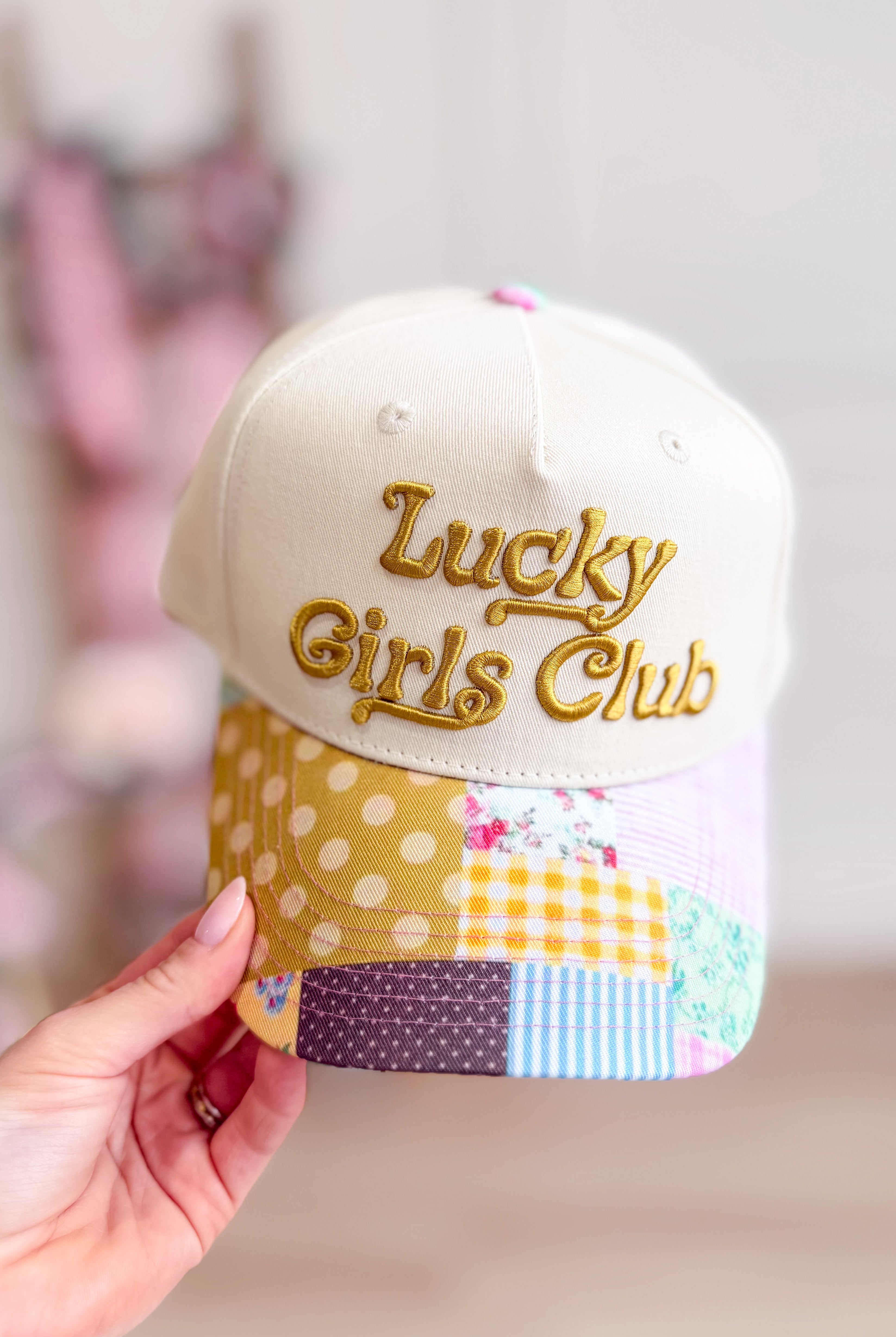 ETTA & EAST Lucky Girls Club trucker hat with mesh back and embroidered logo for stylish hair accessory.