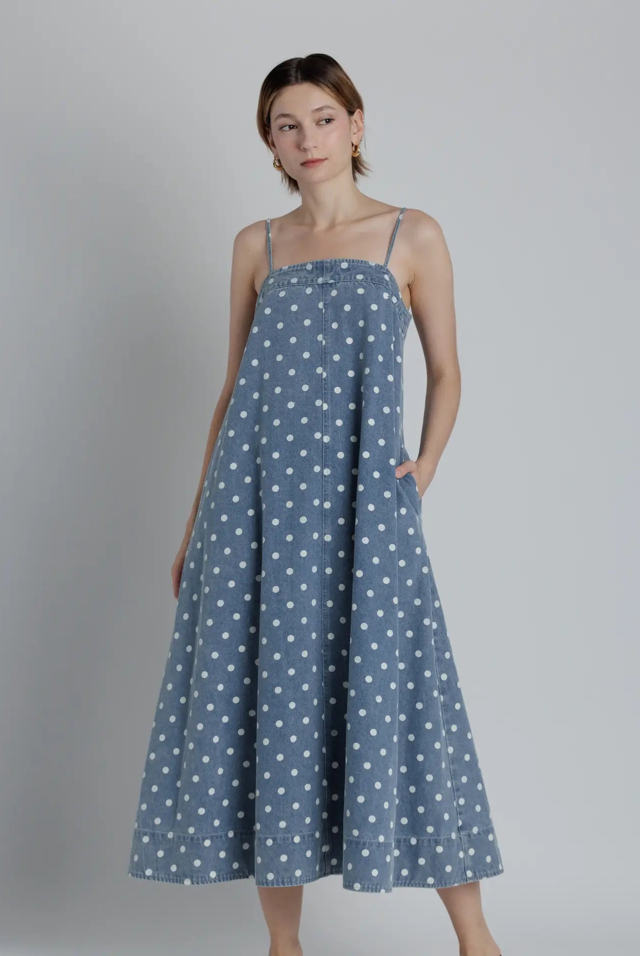 Aureum Mia Polka Dot Denim Dress, a stylish dress with a polka dot pattern and denim fabric, perfect for dressy occasions.