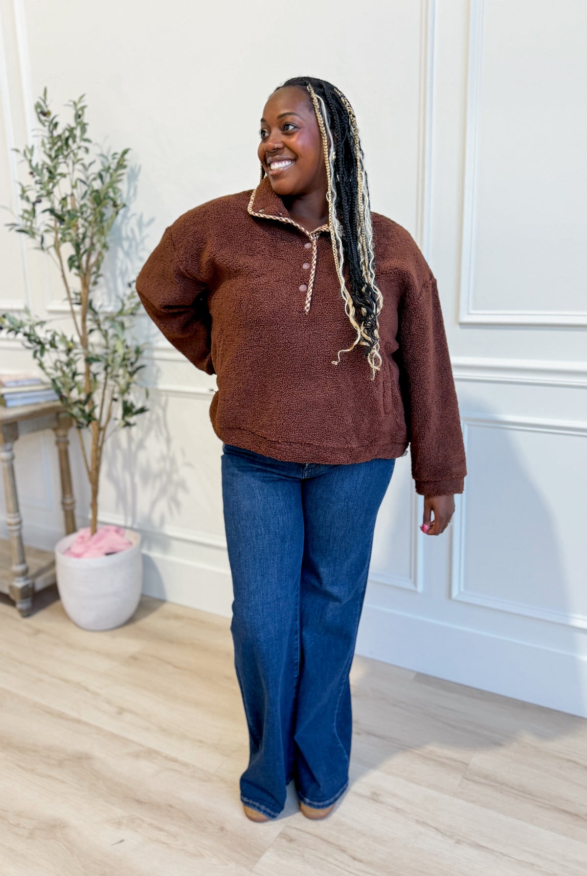 Baevely Eric snap button long sleeve pullover in dark color, featuring a relaxed fit and outerwear design with snap button details.