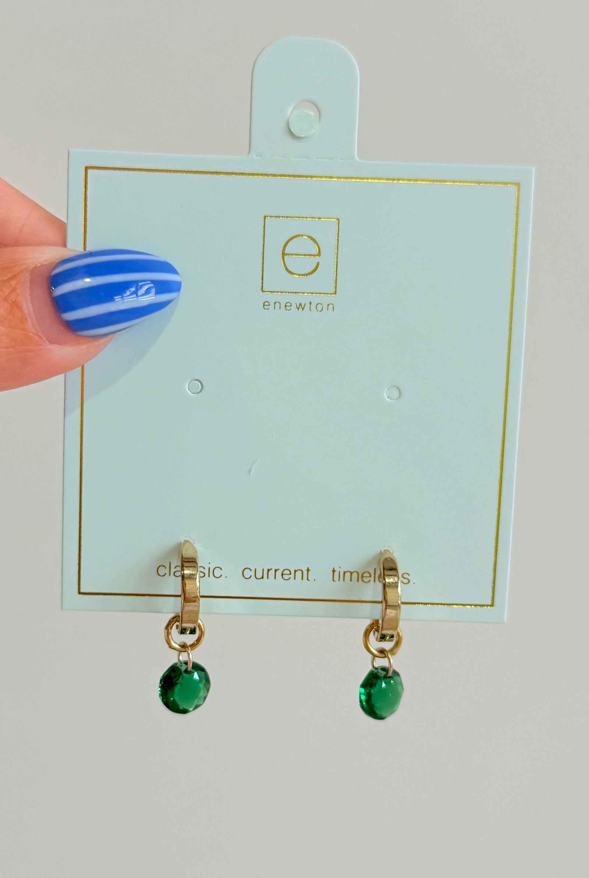 Enewton .5mm Classic Birthstone Huggie earrings featuring a delicate gold hoop with a small birthstone accent.