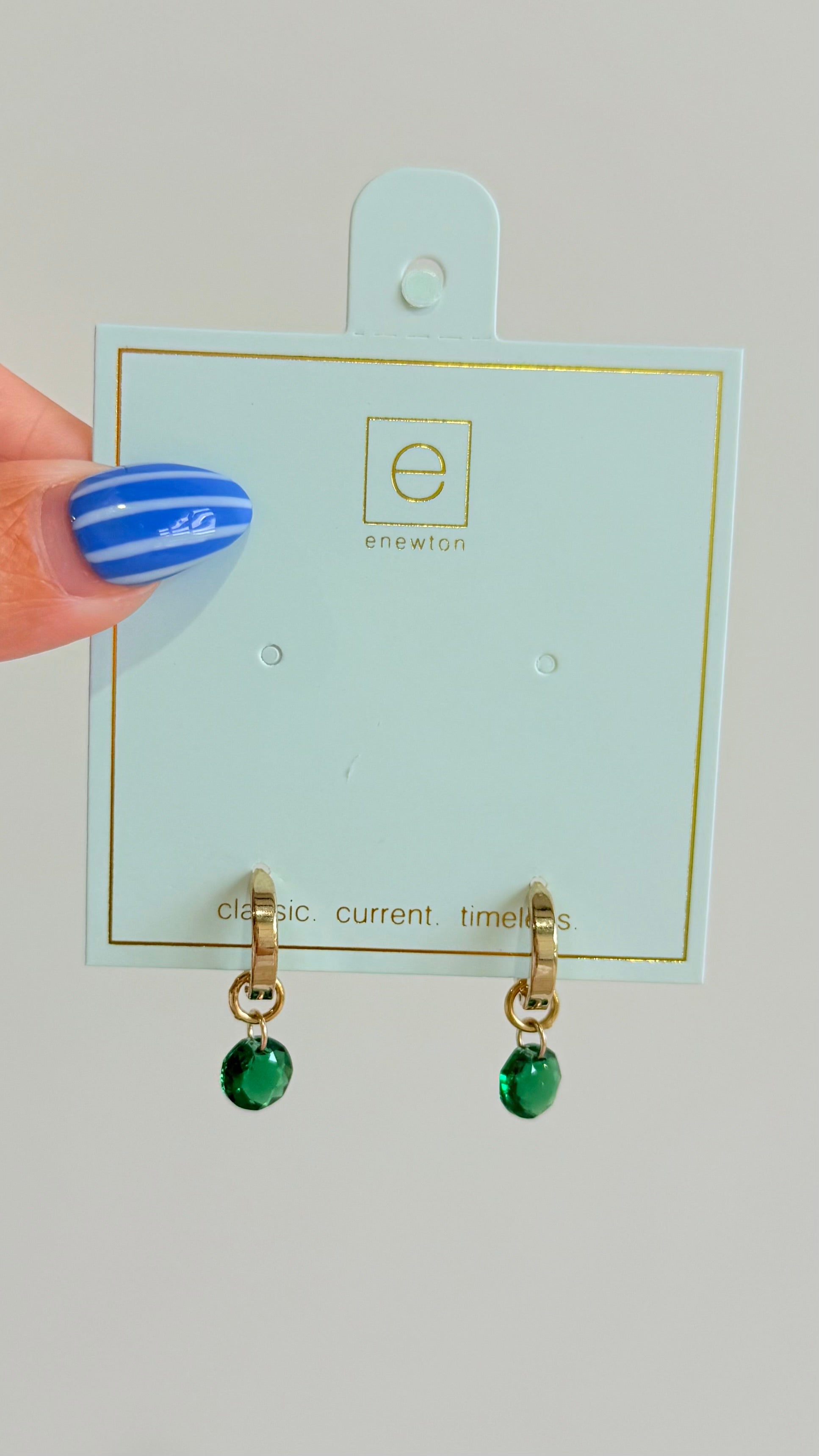 Enewton .5mm Classic Birthstone Huggie earrings featuring a delicate gold hoop with a small birthstone accent.