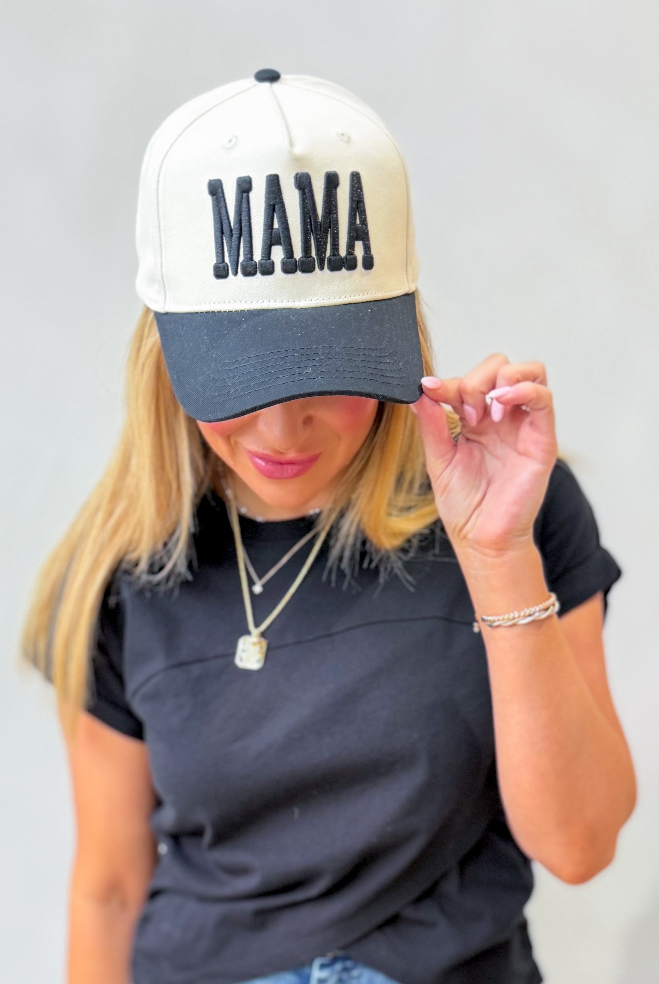 Mama Cream and Black Puff Trucker Hat by ETTA & EAST, featuring a cream front panel and black puffed mesh back.