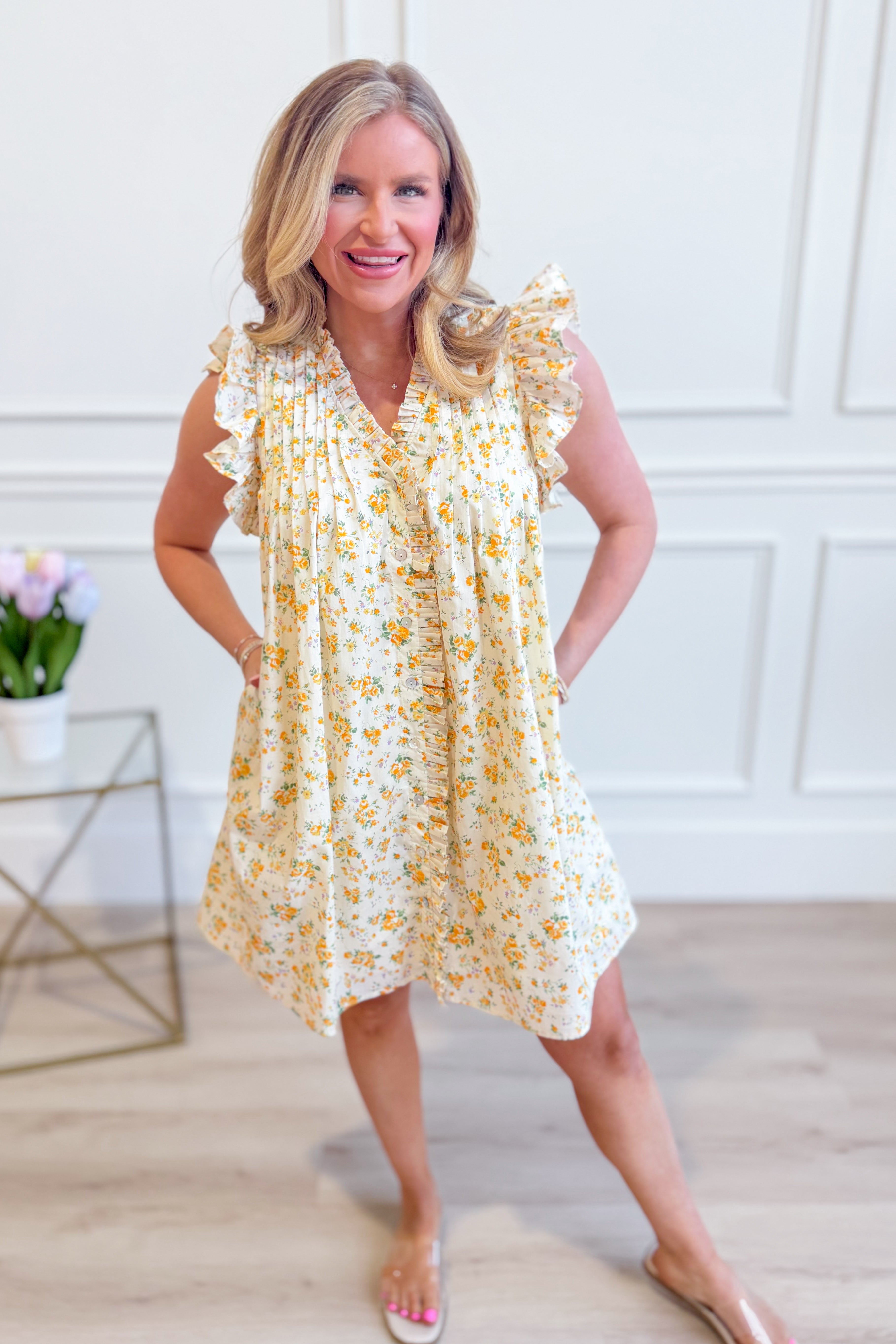 Entro Mindy floral flutter sleeve dress featuring a vibrant floral pattern and elegant flutter sleeves, perfect for dressy occasions.