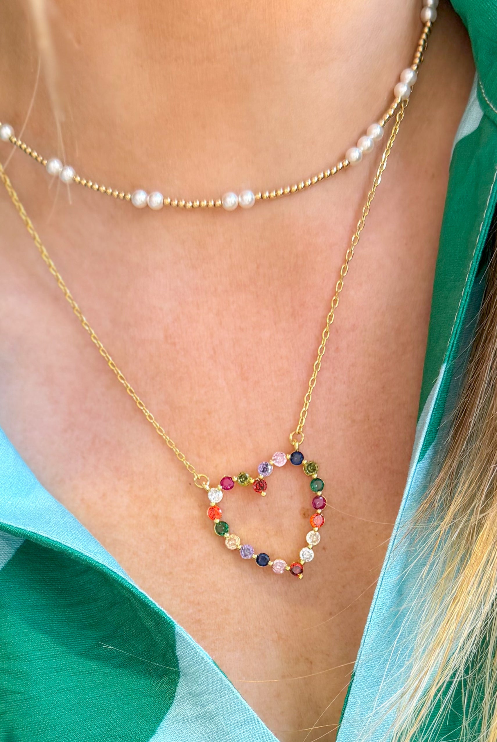 Sparkle multi-heart necklace by Treasure Jewels with shining silver chains and colorful heart-shaped pendants.