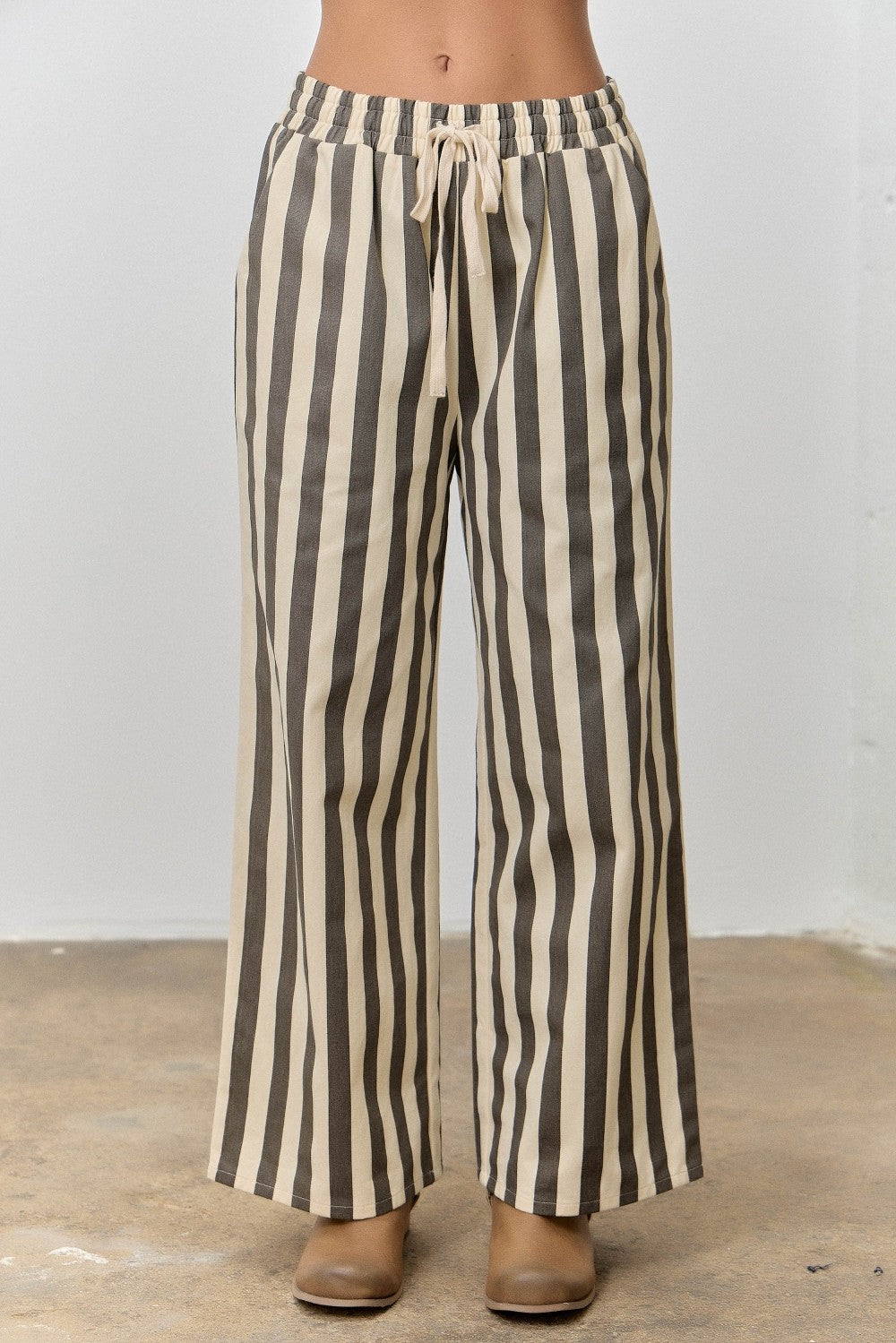 Baevely Kimmy Cream striped drawstring pants with relaxed fit and elastic waistband, featuring vertical stripe pattern.