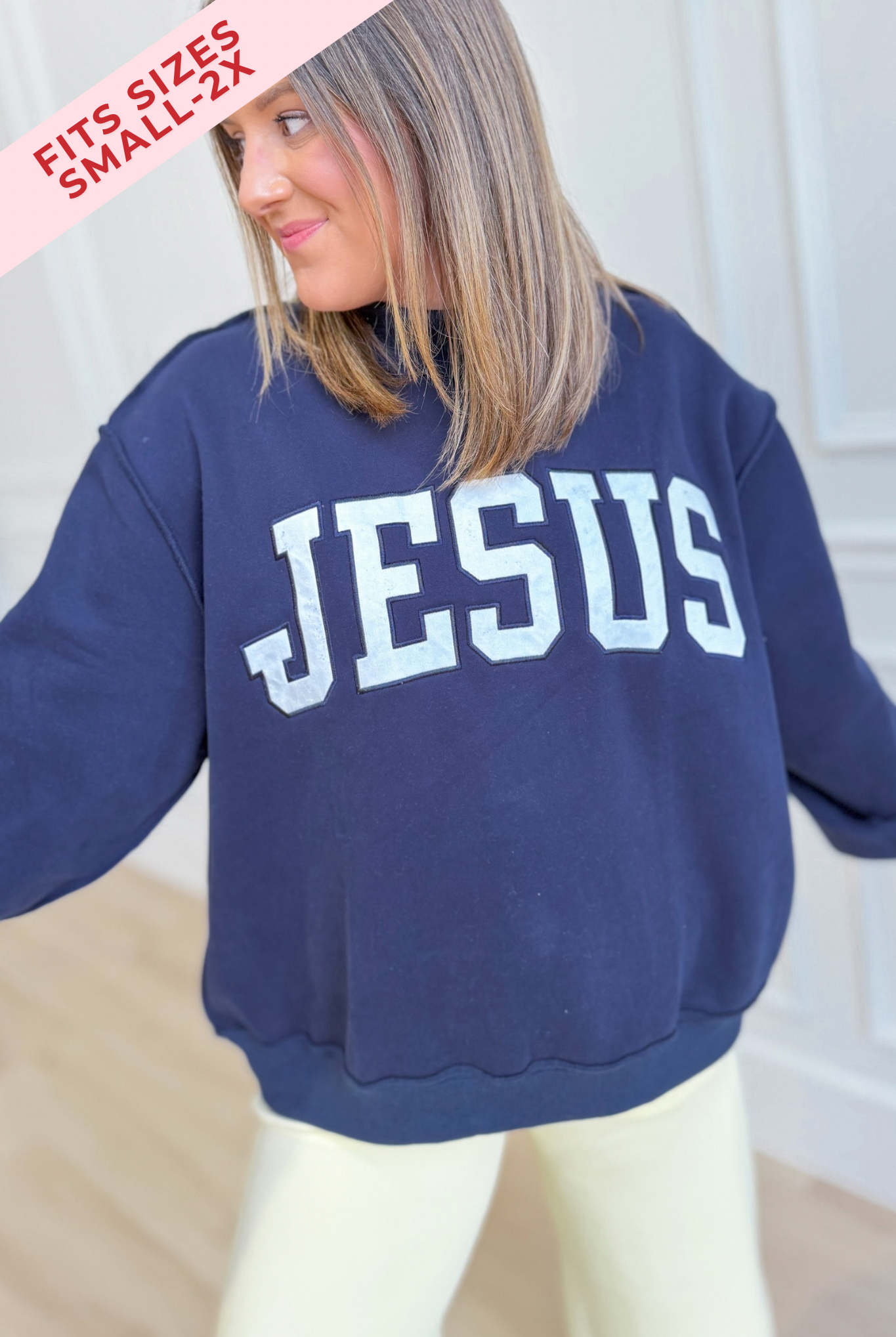 Jesus Navy mock embroidered sweatshirt from BUCKET LIST 137 Graphic Sweatshirts, featuring a navy fabric with embroidered Jesus graphic.