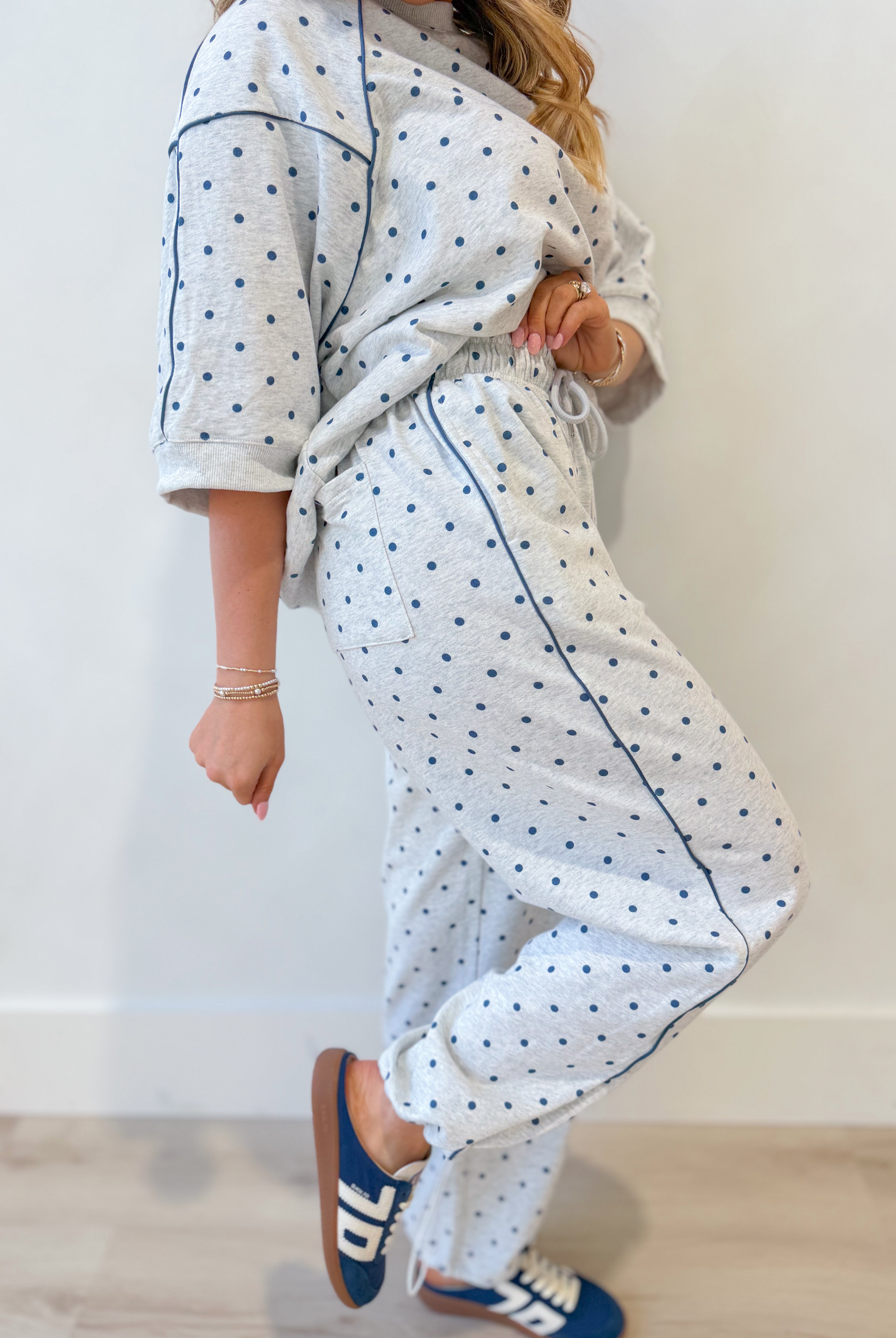 Frederick Grey Polka Dot French Terry Track Pants by PEACH LOVE, with elastic waistband and relaxed fit, shown in a casual setting.