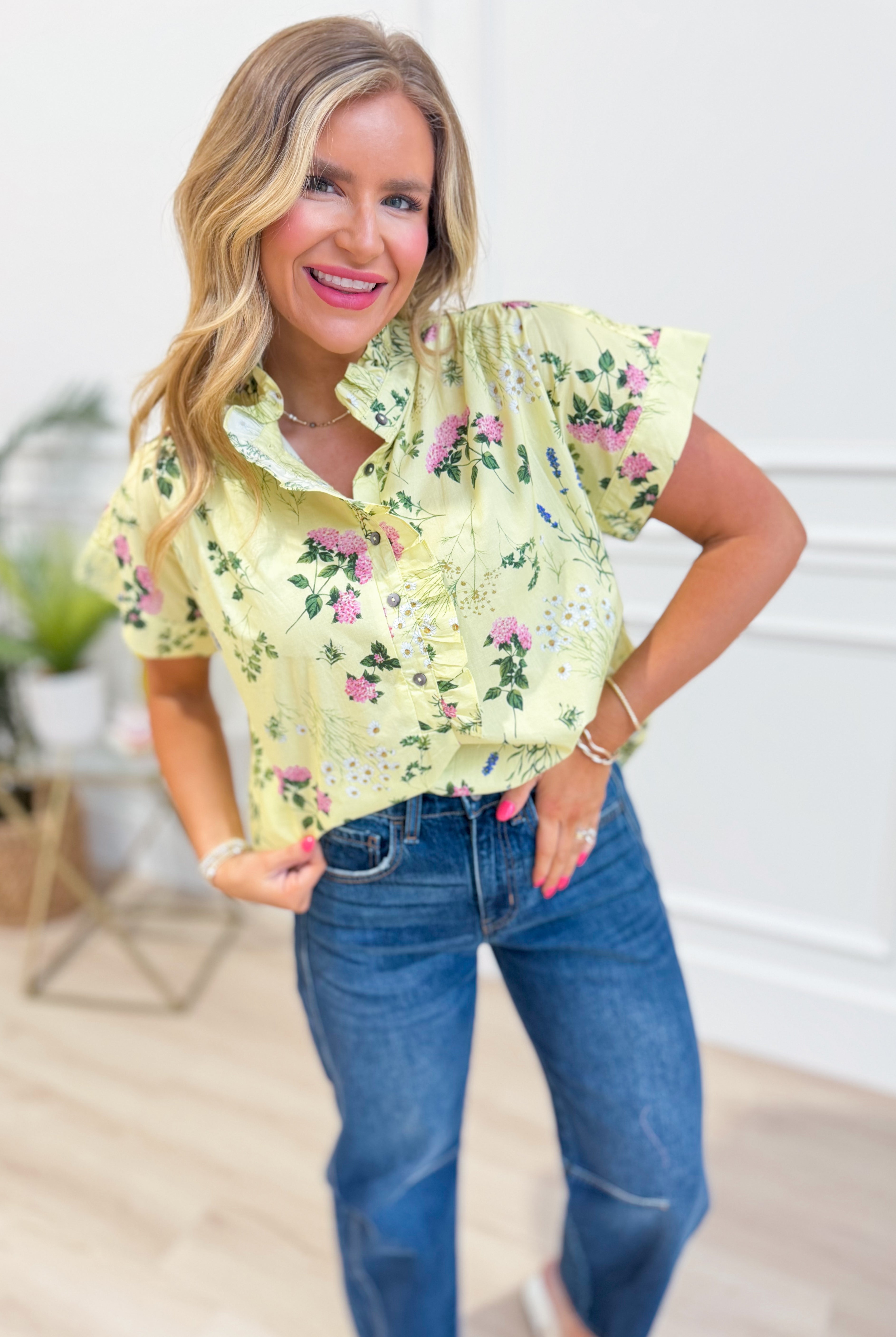 Beth Floral Ruffle Trim Top by ENTRO, featuring a feminine floral pattern and ruffle details, perfect for dressy occasions.