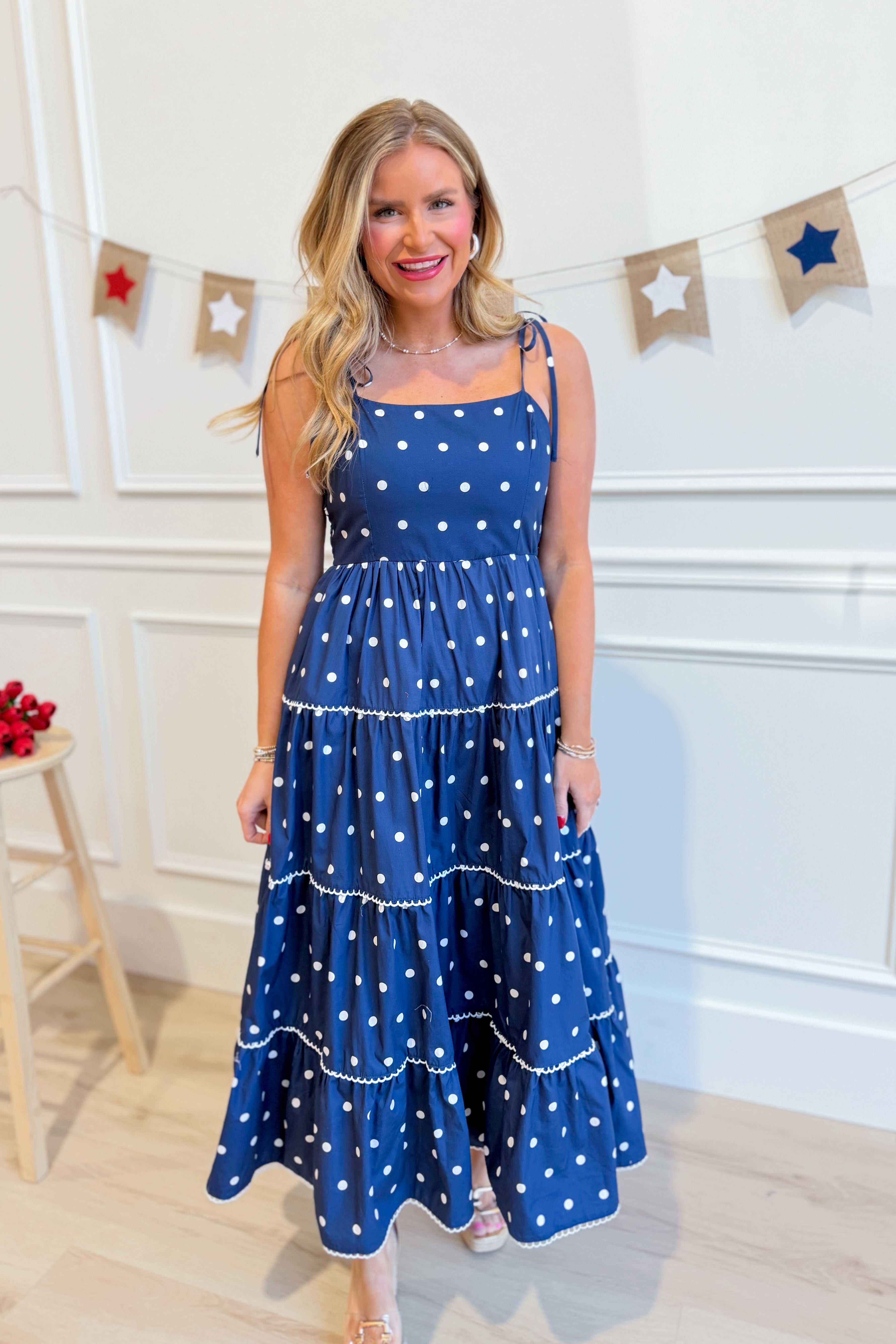 Vicki Polka Dot Tiered Midi Dress by PEACH LOVE featuring a flowy, tiered silhouette with polka dot pattern for casual wear.