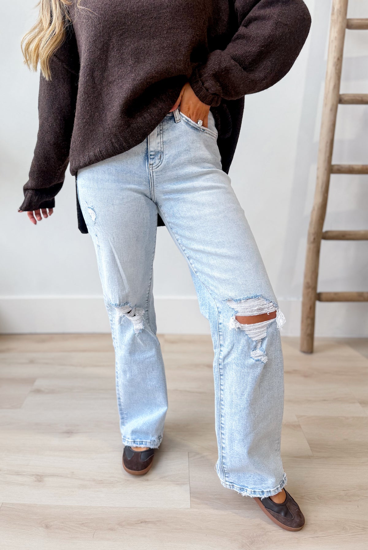 Vervet Slick high rise vintage wide-leg jeans, 146 Core Jeans, with classic denim wash and relaxed fit, displayed on a hanger.