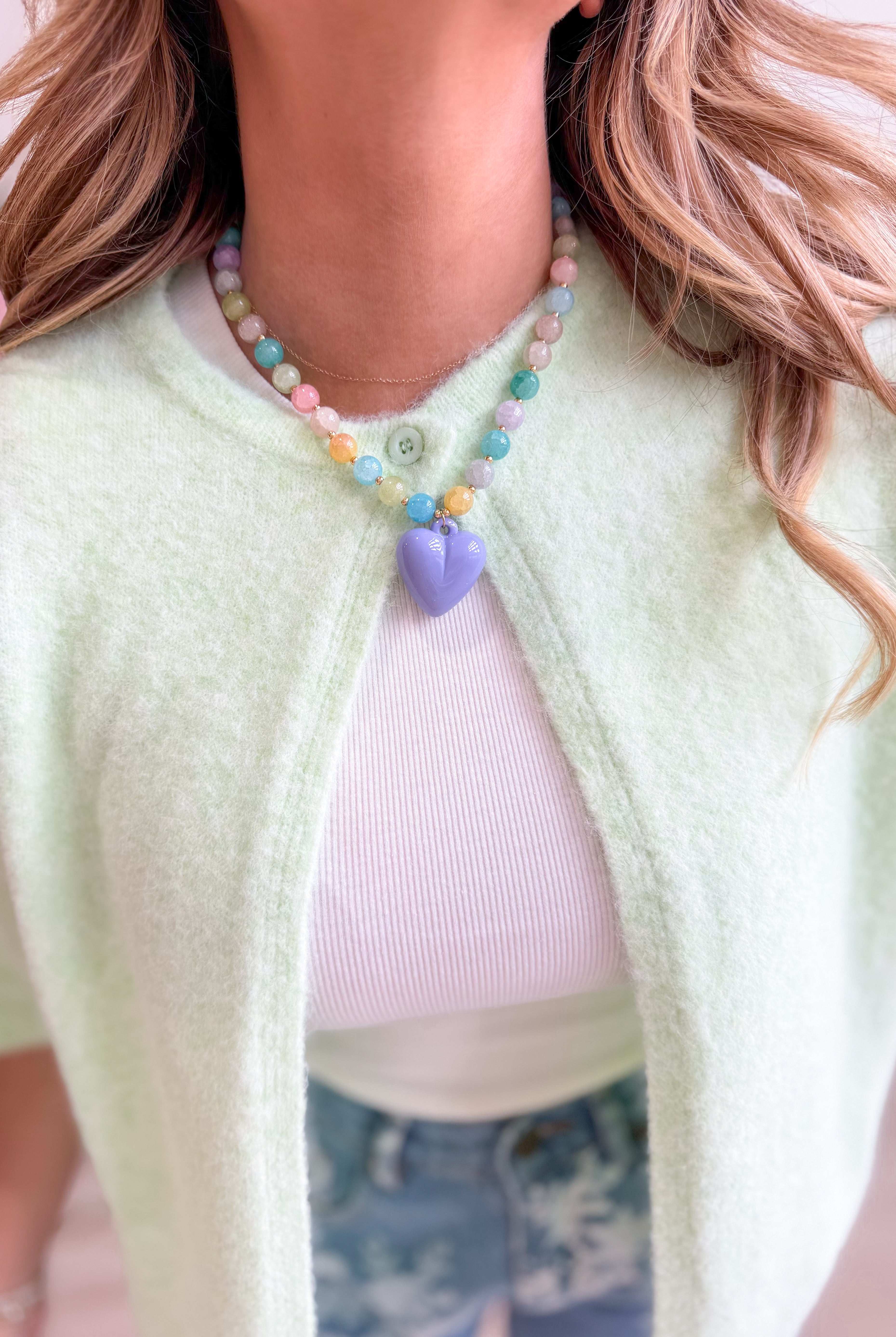 Colorful heart-shaped necklace from Treasure Jewels featuring lavender and vibrant hues, suitable for jewelry and accessory lovers.