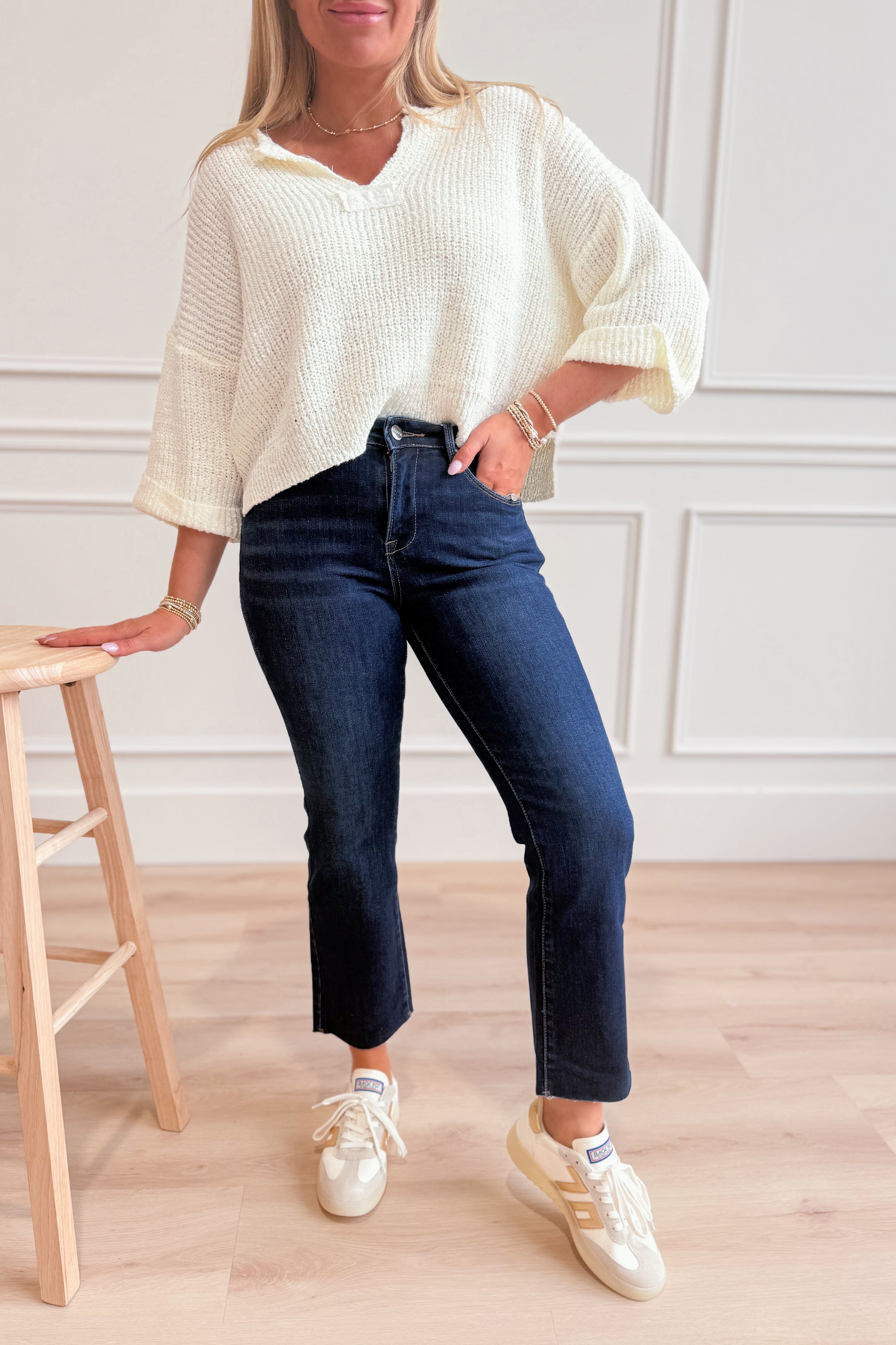 RISEN Risen John mid-rise straight raw edge jeans in dark denim, featuring a classic fit and distressed hem.