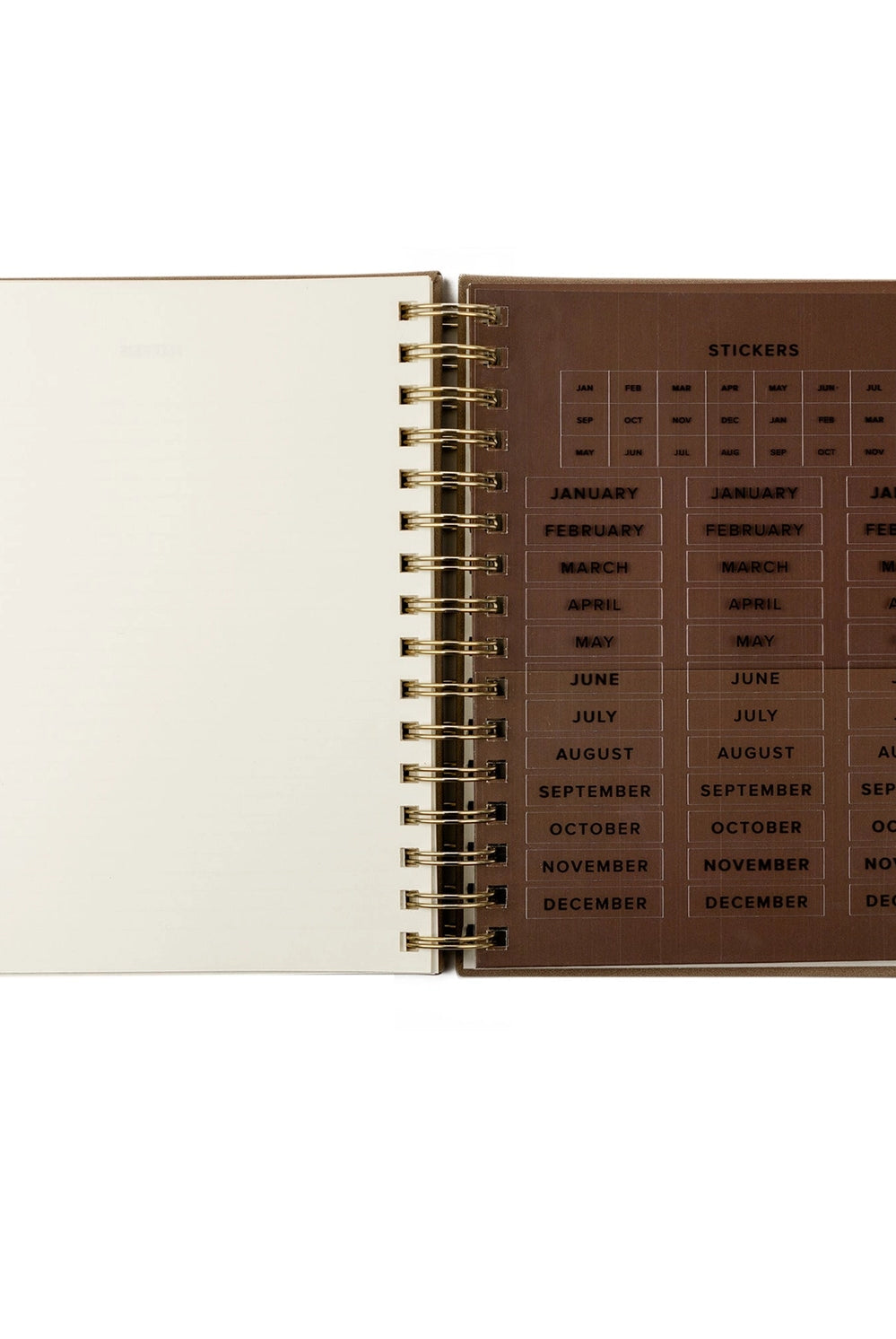 Undated 12-month planner by HOSANNA REVIVAL with a stylish cover, designed for organizing schedules and dates efficiently.