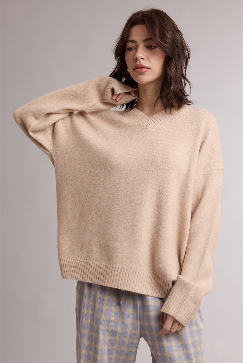 Wishlist Noelle Milk Tea Classic V Neck Sweater from the 132 Fall Sweaters collection, featuring a cozy cream-colored knit with a V neckline.