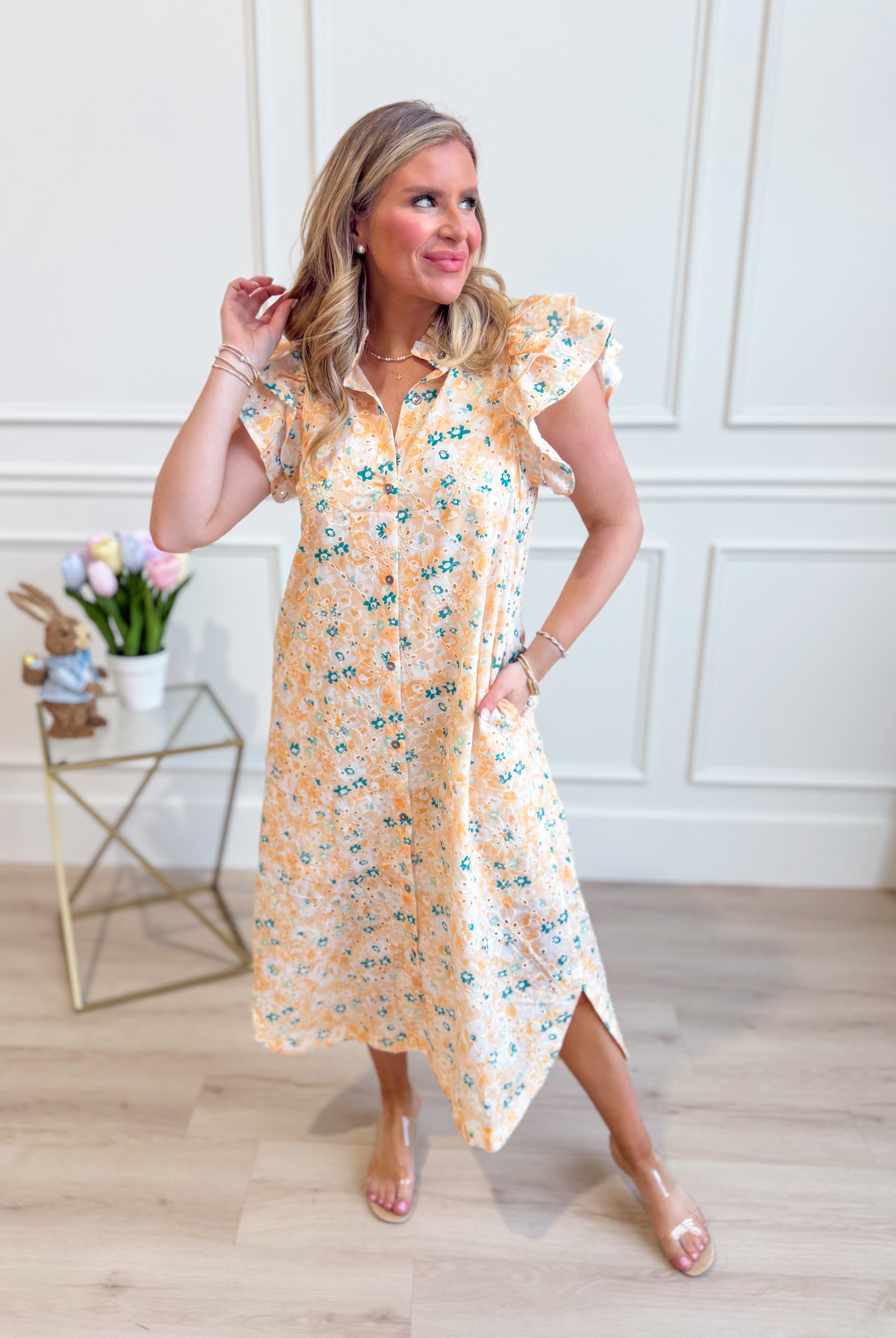 ENTRO Aubrey yellow floral flutter sleeve dress with a flowy silhouette and vibrant floral pattern, perfect for dressy occasions.