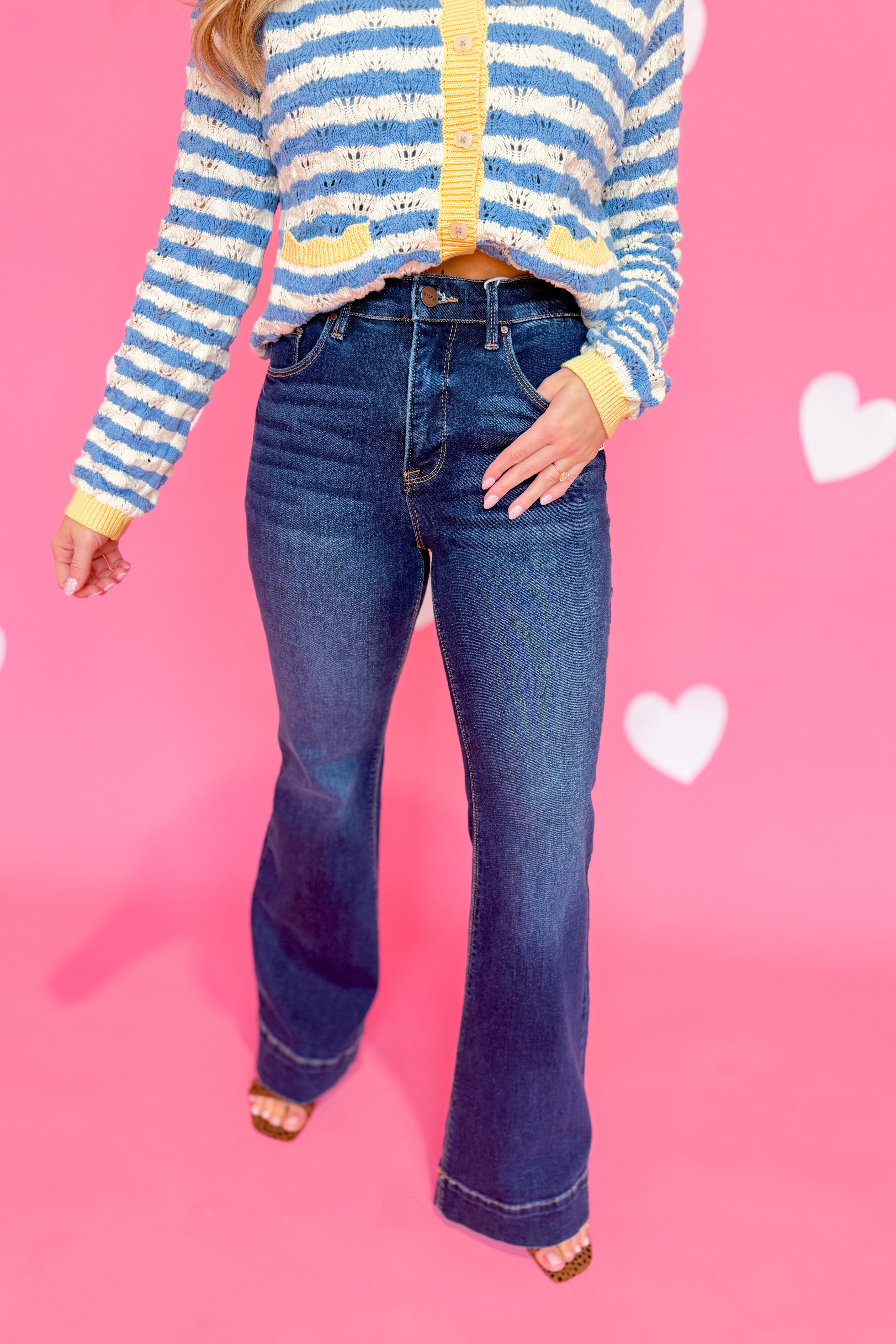 Risen Linus high-rise tummy control flare jeans in classic denim with fitted waist and flared leg silhouette.