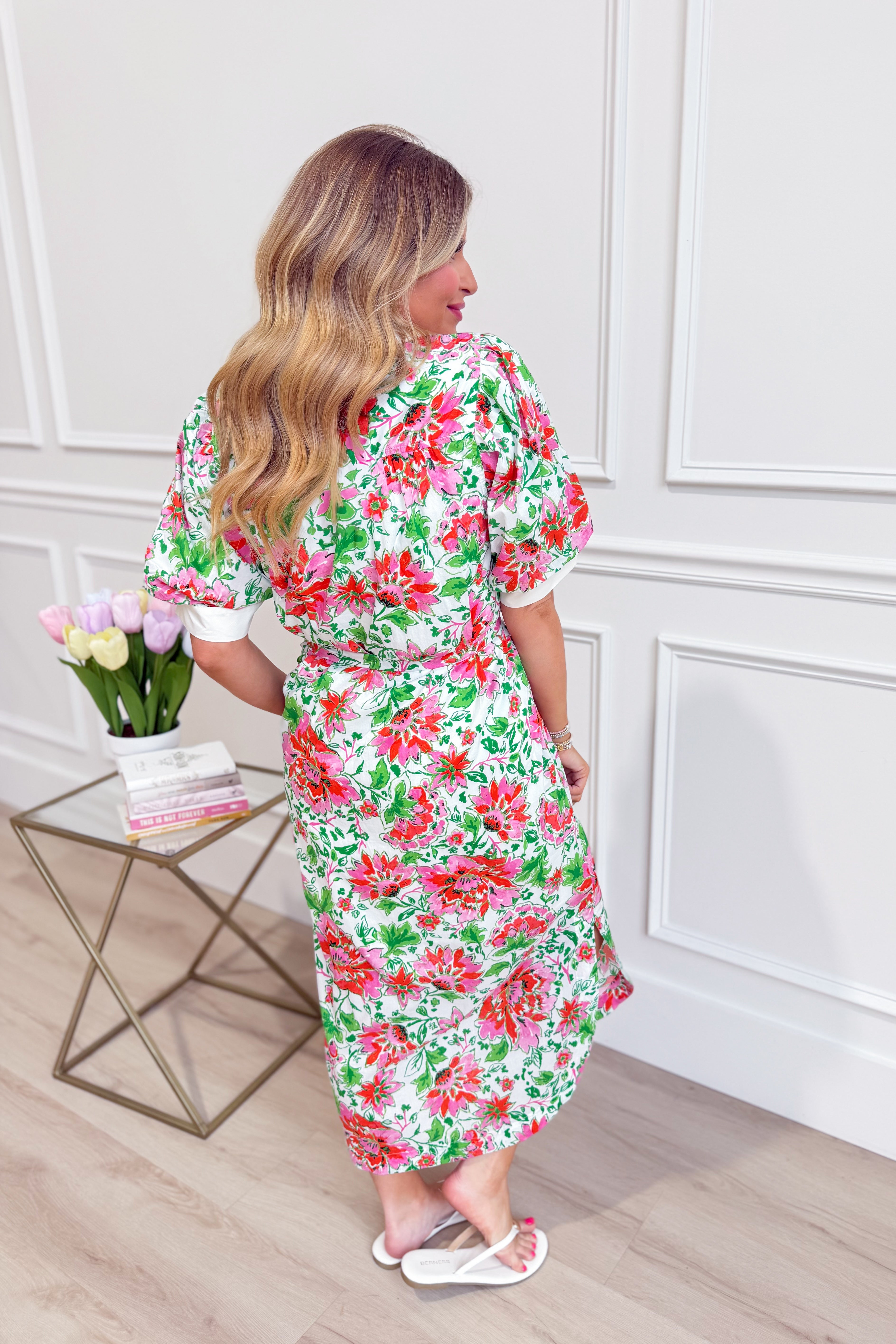 ENTRO Kristy floral printed short sleeve dress featuring a vibrant floral pattern and a comfortable, stylish fit.