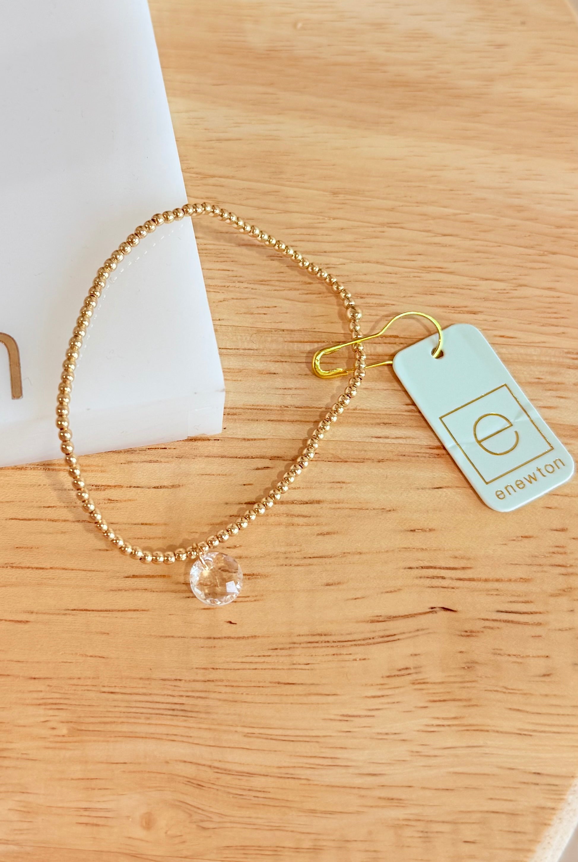 Enewton 2mm Classic Birthstone Bracelet featuring colorful gemstone beads and silver clasp on a white background.