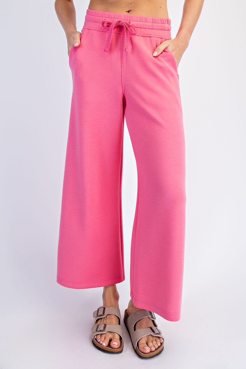 Bright pink Norma cropped wide-leg pants by RAE MODE displayed on a model, showing the relaxed fit and stylish design.