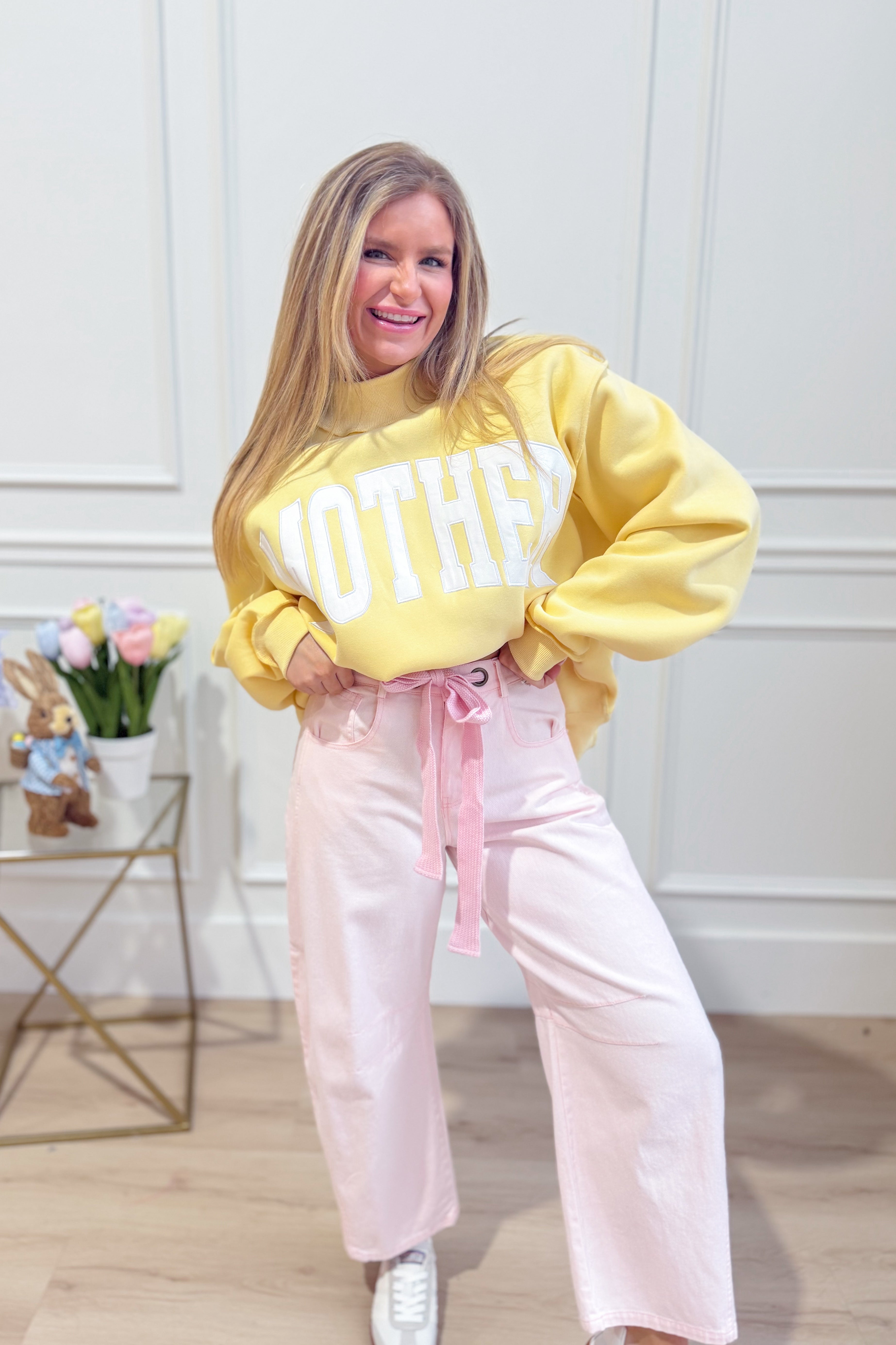Light pink PEACH LOVE Candice mineral washed eyelet barrel jeans with novelty details and relaxed fit.